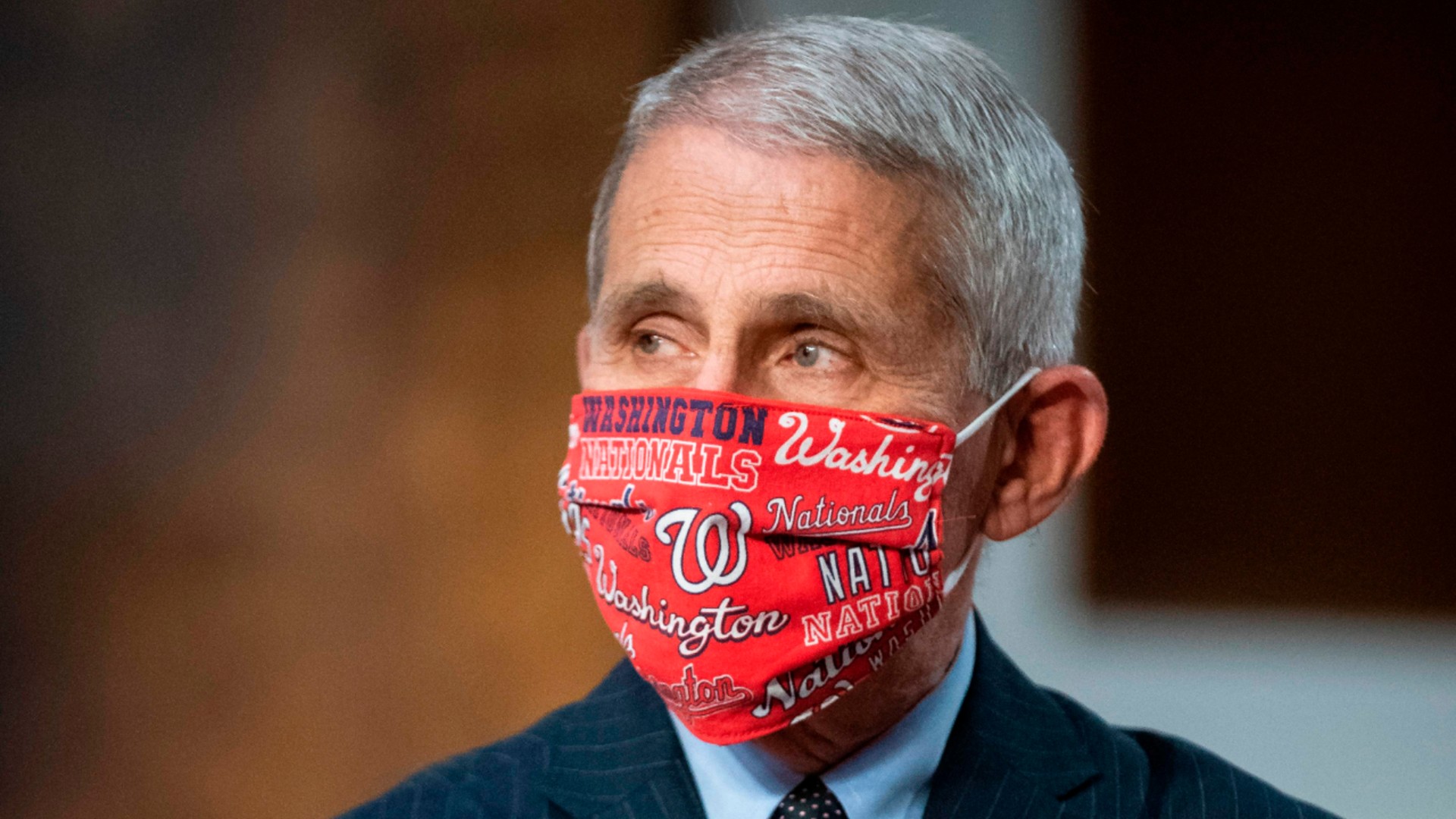 Dr. Anthony Fauci, director of the National Institute of Allergy and Infectious Diseases, wears a Washington Nationals face covering as he arrives during a Senate Health, Education, Labor and Pensions Committee hearing in Washington, DC, on June 30, 2020. (AL DRAGO/AFP via Getty Images)