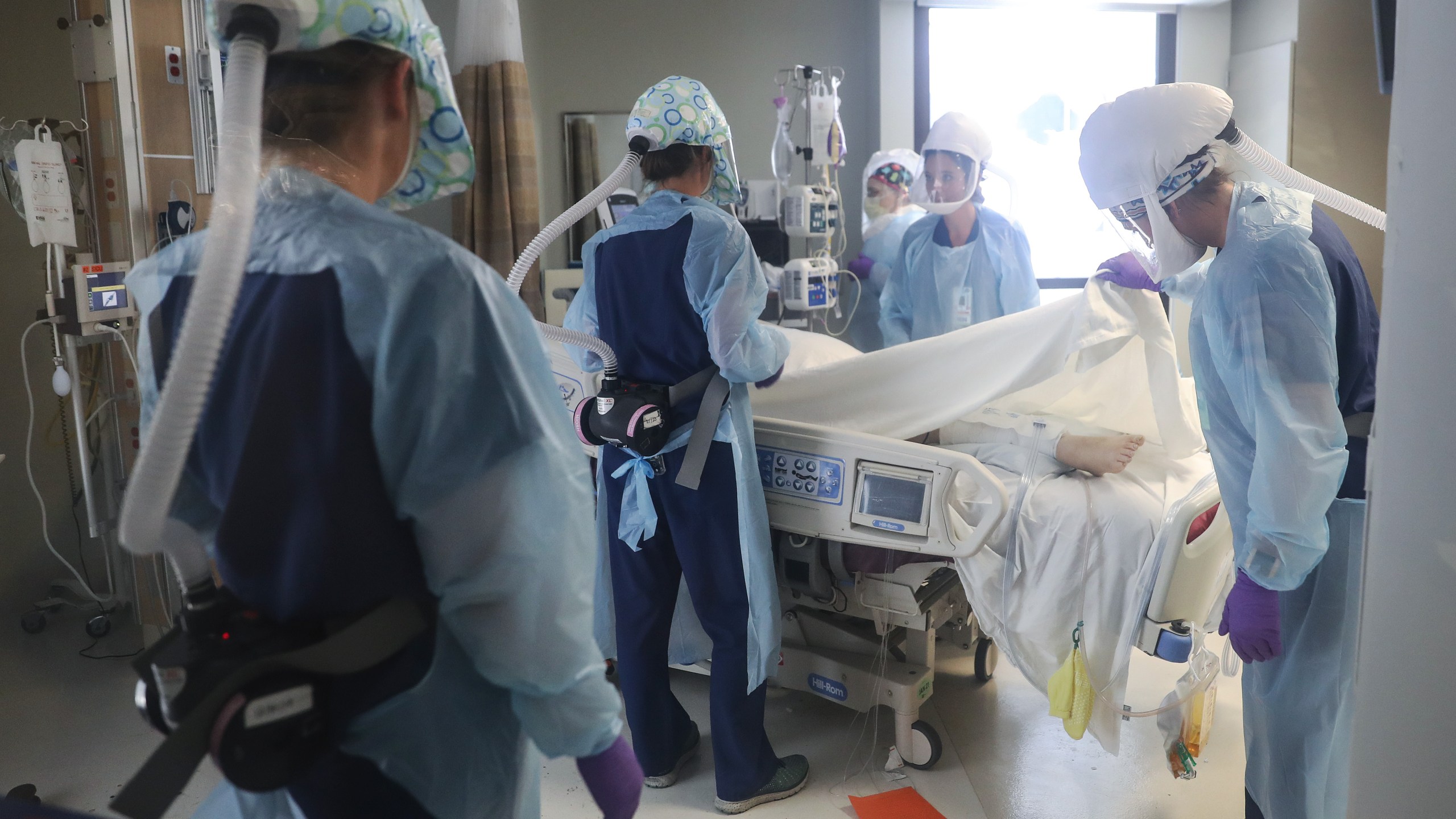 Clinicians wearing personal protective equipment care for a COVID-19 patient in the intensive care unit at Sharp Memorial Hospital amid the coronavirus pandemic on May 6, 2020 in San Diego. (Mario Tama/Getty Images)