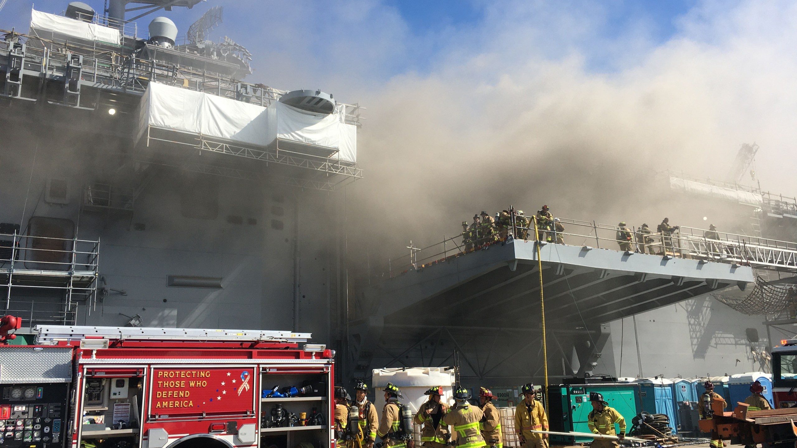 Sailors and Federal Fire San Diego firefighters combat a fire aboard the amphibious assault ship USS Bonhomme Richard (LHD 6), July 12, 2020. (Mass Communication Specialist 1st Class Jason Kofonow/U.S. Navy via Getty Images)