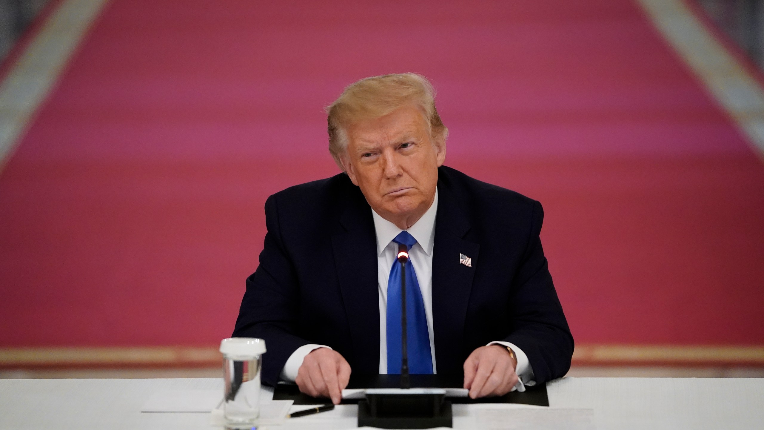 U.S. President Donald Trump listens during an event about citizens positively impacted by law enforcement, in the East Room of the White House on July 13, 2020. (Drew Angerer/Getty Images)