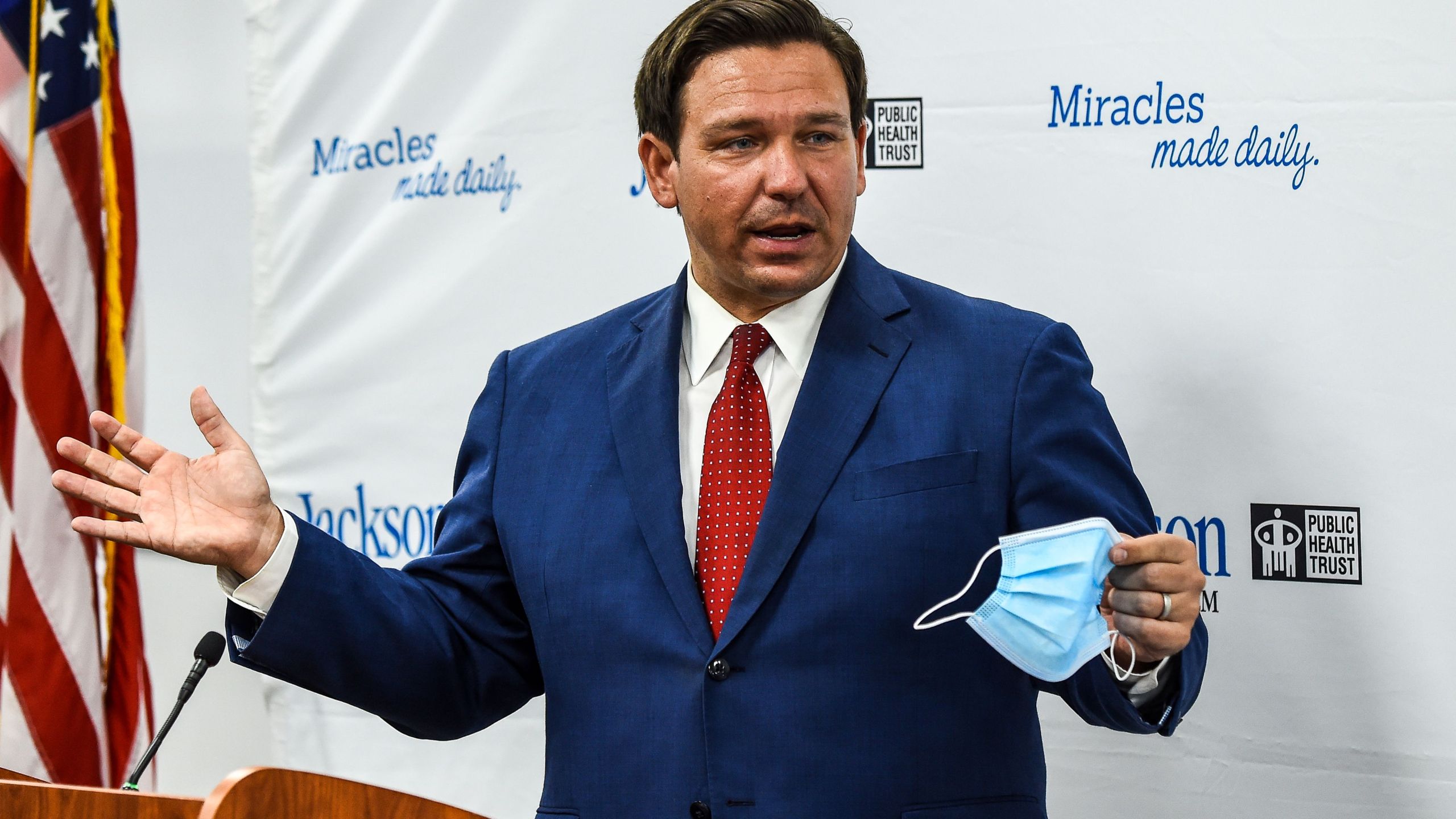 Florida Gov. Ron DeSantis speaks holding his facemask during a press conference to address the rise of coronavirus cases in the state, at Jackson Memorial Hospital in Miami on July 13, 2020. (CHANDAN KHANNA/AFP via Getty Images)