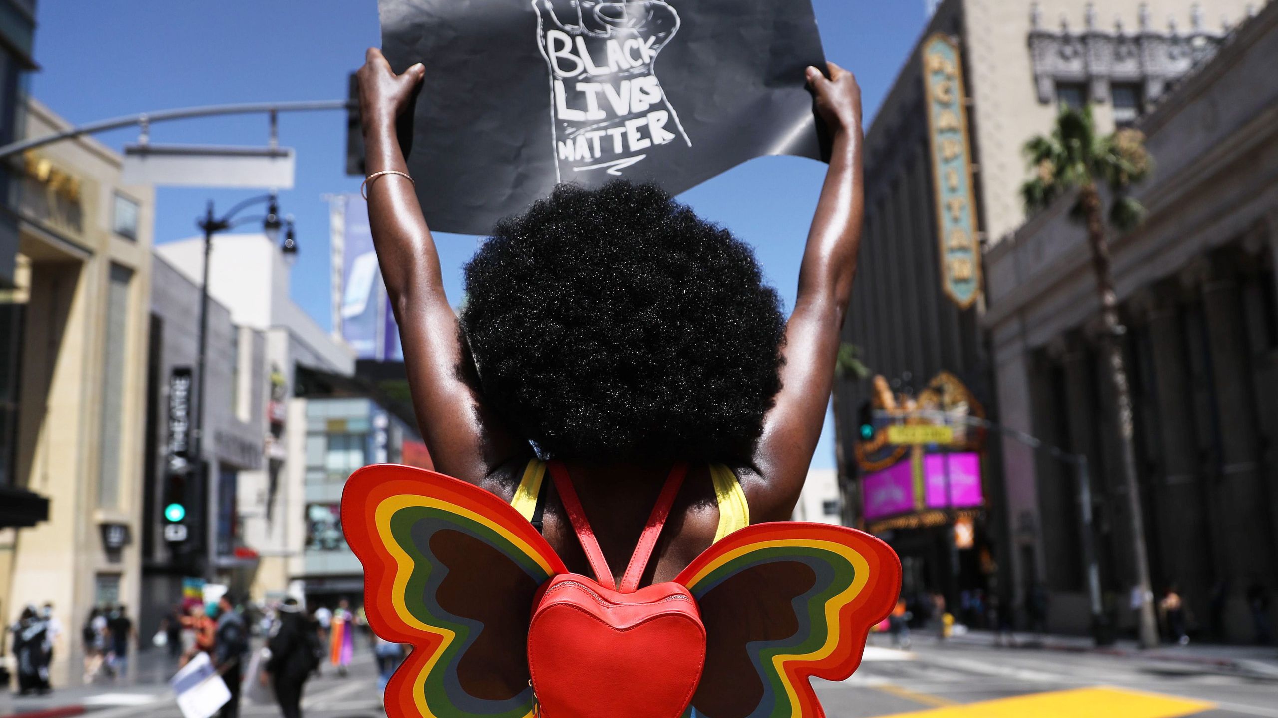 A protester holds a "Black Lives Matter" sign on Hollywood Boulevard during the All Black Lives Matter solidarity march, replacing the annual gay pride celebration, as protests continue in the wake of George Floyd’s death on June 14, 2020. (Mario Tama/Getty Images)