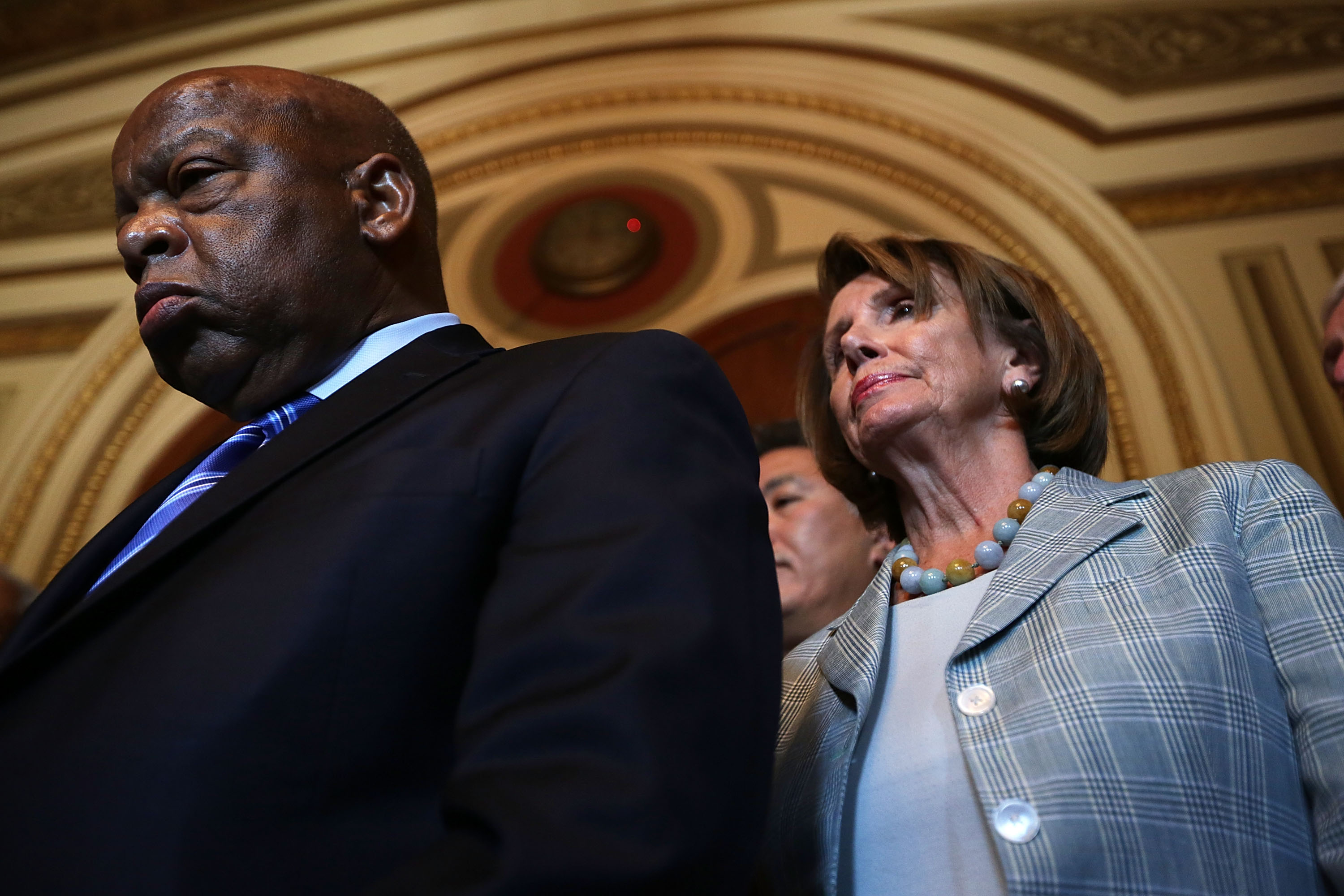 U.S. Rep. John Lewis (D-GA) and House Democratic Leader Rep. Nancy Pelosi (D-CA) listen during a news conference on LGBT discrimination on July 23, 2015 on Capitol Hill in Washington, D.C. (Alex Wong/Getty Images)