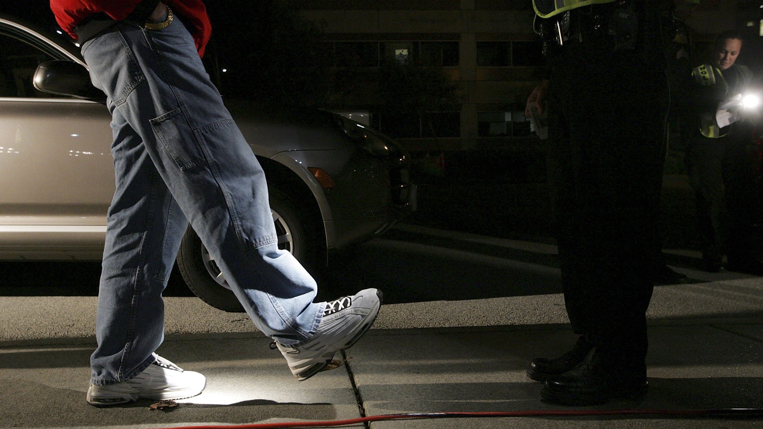 A man is given a field sobriety test after he was stopped by police officers at a DUI checkpoint in San Bruno in this file photo from Nov. 27, 2006. (Justin Sullivan/Getty Images)