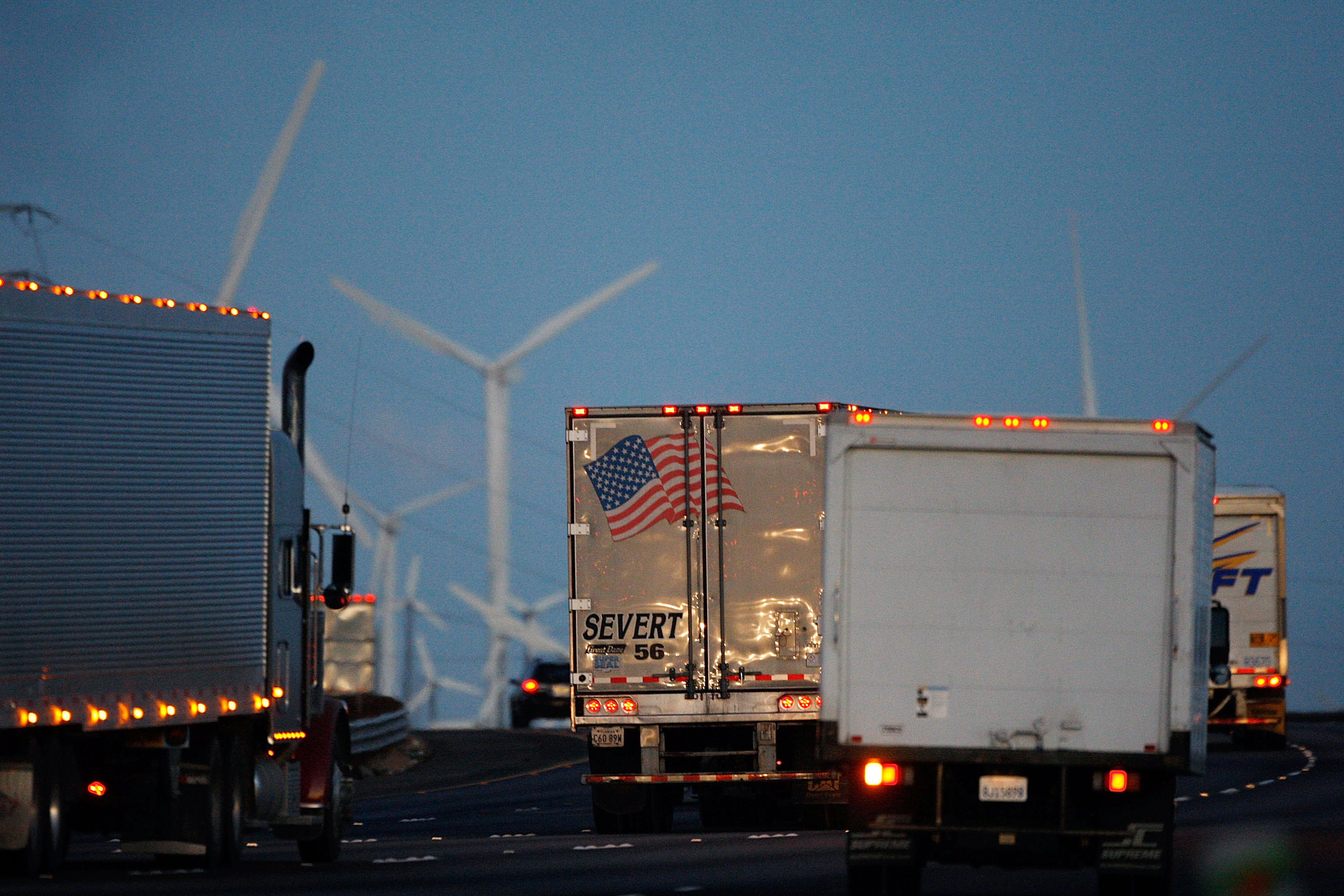 Trucks pass windmills on the 10 Freeway on Dec. 8, 2009 near Banning. (David McNew/Getty Images)