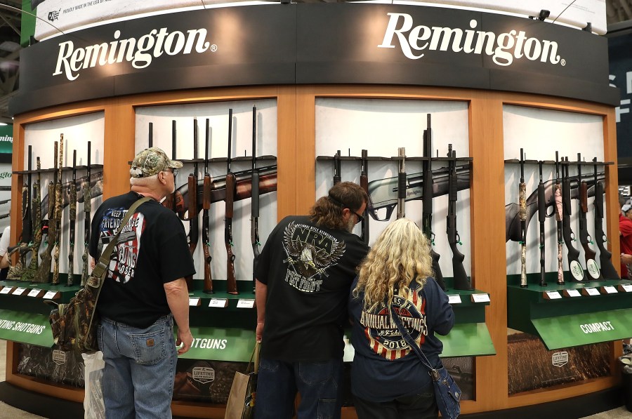 Attendees look at a display of Remington shotguns during the NRA Annual Meeting & Exhibits at the Kay Bailey Hutchison Convention Center on May 5, 2018 in Dallas, Texas. (Justin Sullivan/Getty Images)