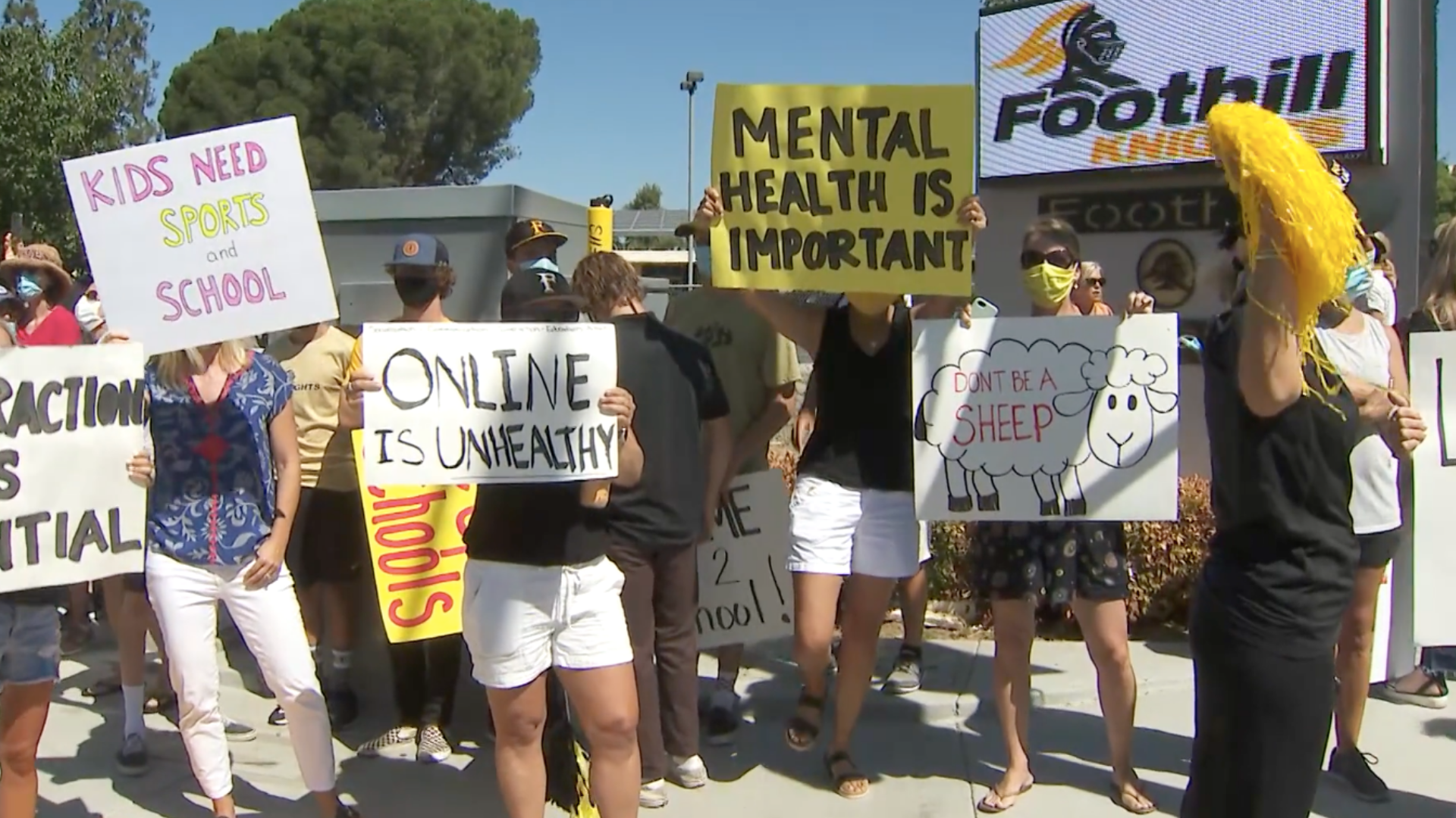 Parents and students rally outside Foothill High School in North Tustin on July 18, 2020. (KTLA)