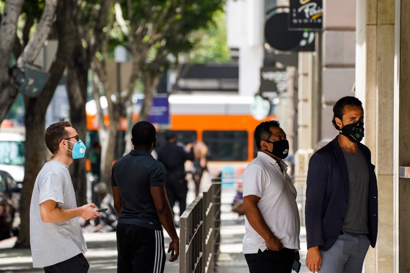 L.A. residents who go maskless could face an escalating system of fines under a proposal unveiled Wednesday. (Kent Nishimura/Los Angeles Times)