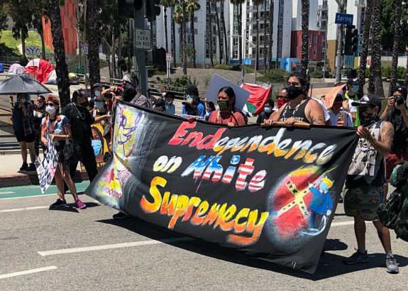 Demonstrators gather on July 4, 2020, near Olvera Street in Los Angeles.(Andrew J. Campa / Los Angeles Times)