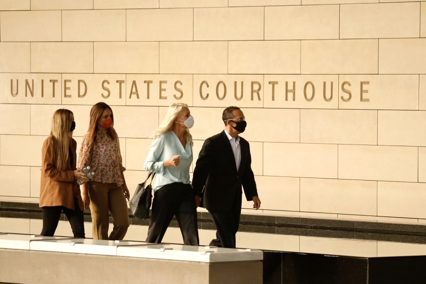 Former Los Angeles City Councilman Mitchell Englander arrives at the federal courthouse in downtown Los Angeles on July 7, 2020 with his family. (Al Seib/Los Angeles Times)