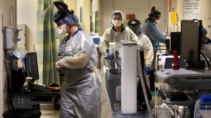 Medical staffers work inside a COVID-19 isolation area at Los Angeles County-USC Medical Center in this undated photo. (Mel Melcon / Los Angeles Times)