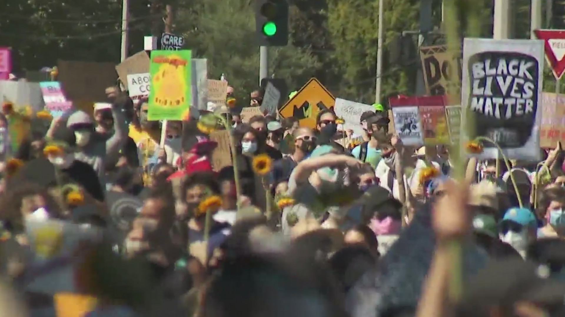 During a demonstration nearly two years after the death of Melyda Corado, protesters march in honor of the 27-year-old in the same area of Silver Lake where she was killed. An innocent bystander, she was fatally shot by an LAPD officer in a shootout just outside the Trader Joe's grocery store where she worked, on July 21, 2018.