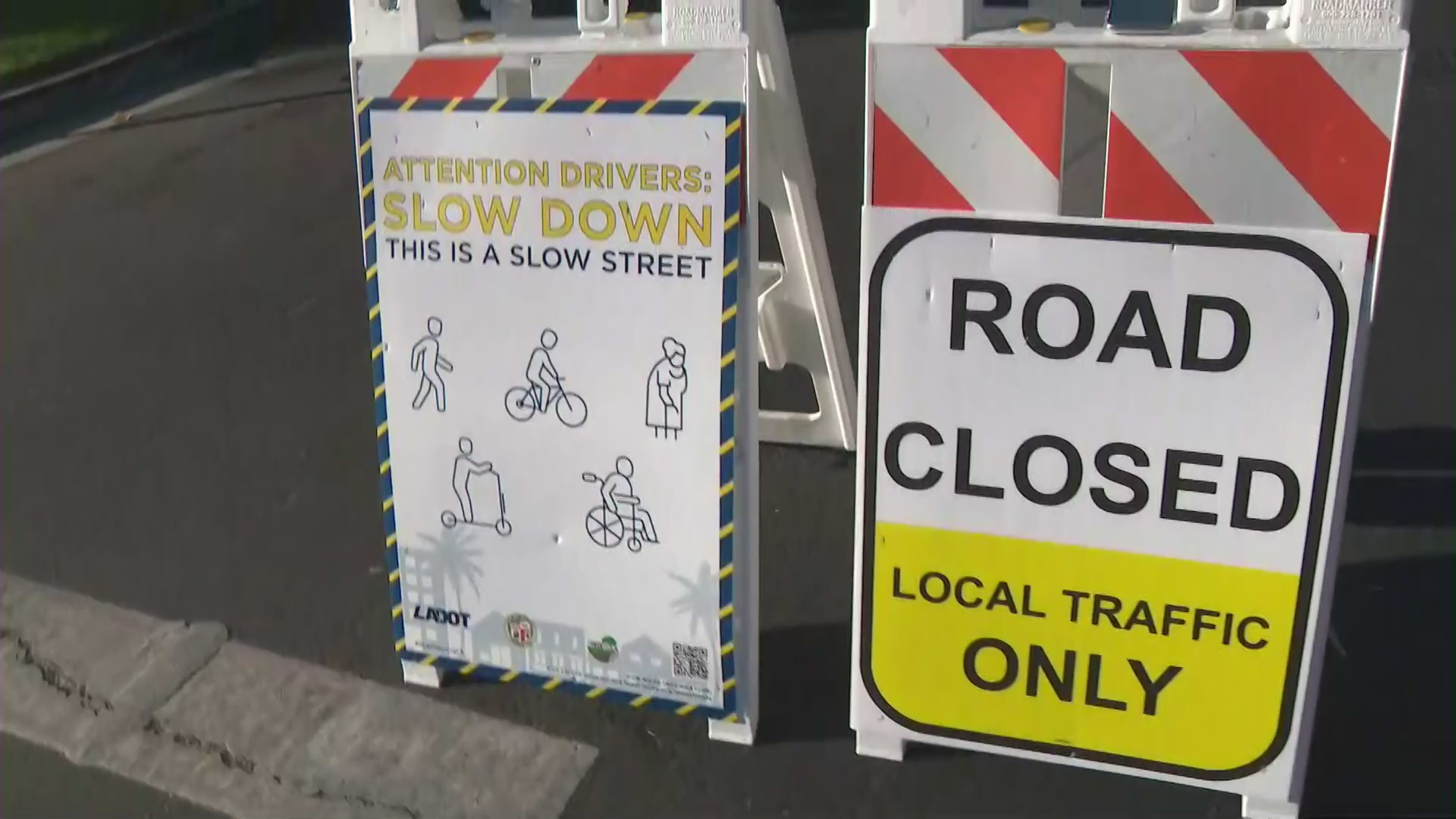 A sign for the city of L.A.'s "slow streets" program is seen in Palms on July 18, 2020. (KTLA)