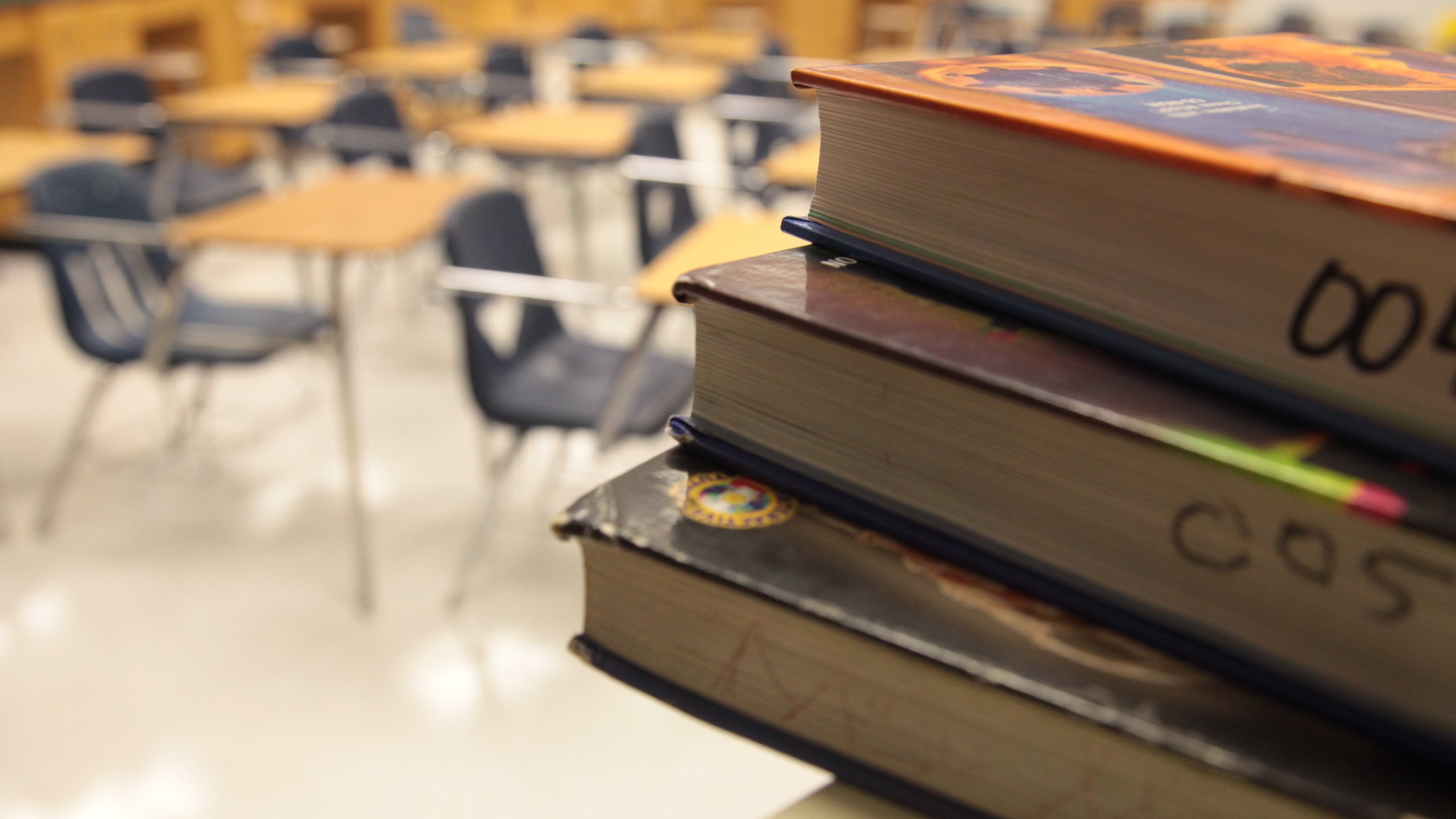 A file photo shows textbooks and empty student desks inside an Atlanta, Georgia school.