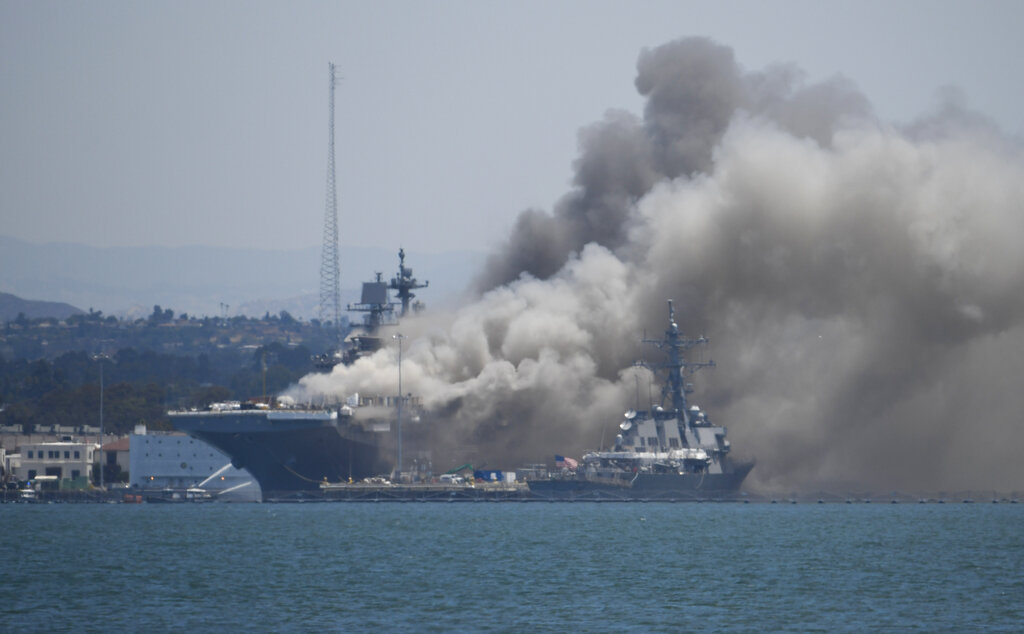 Smoke rises from the USS Bonhomme Richard at Naval Base San Diego. (AP Photo/Denis Poroy)