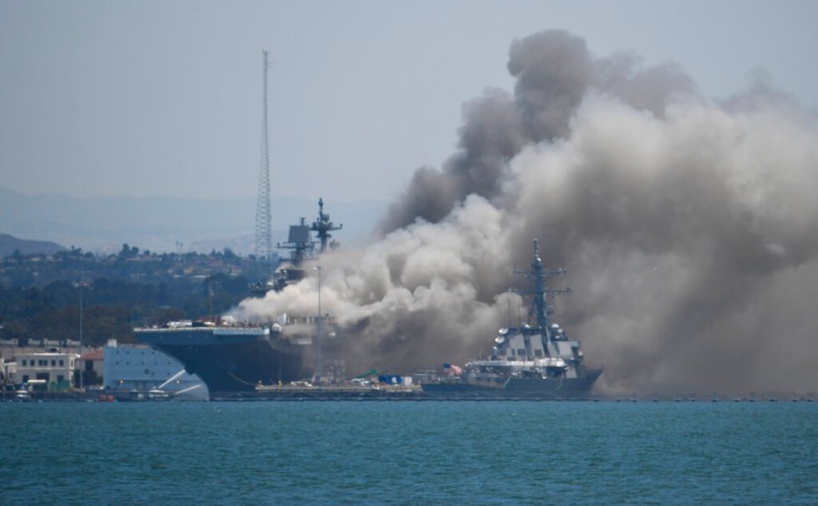 Smoke rises from the USS Bonhomme Richard at Naval Base San Diego. (AP Photo/Denis Poroy)