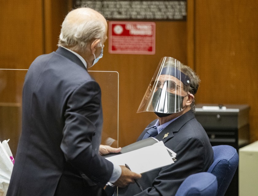 George Tyndall, right, USC’s former longtime campus gynecologist, confers with attorney Leonard Levine on July 24, 2020. (Brian van der Brug / Los Angeles Times)