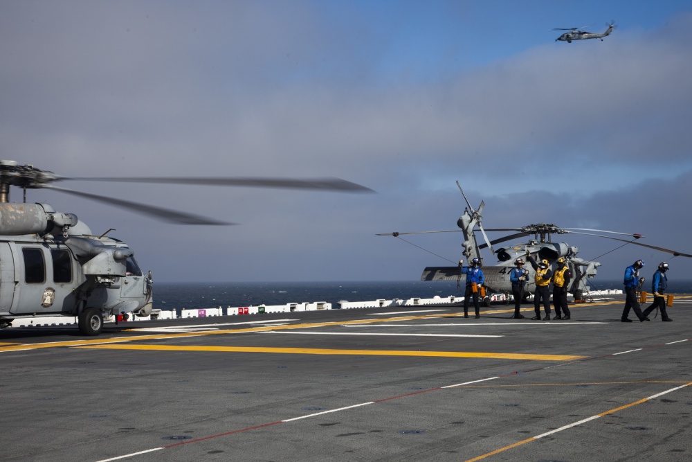 U.S. Navy MH-60 Seahawks takeoff from the amphibious assault ship USS Makin Island (LHD-8) to conduct search and rescue operations following an AAV-P7/A1 assault amphibious vehicle accident off San Clemente Island on July 30, 2020. (Cpl. Patrick Crosley/15th Marine Expeditionary Unit)