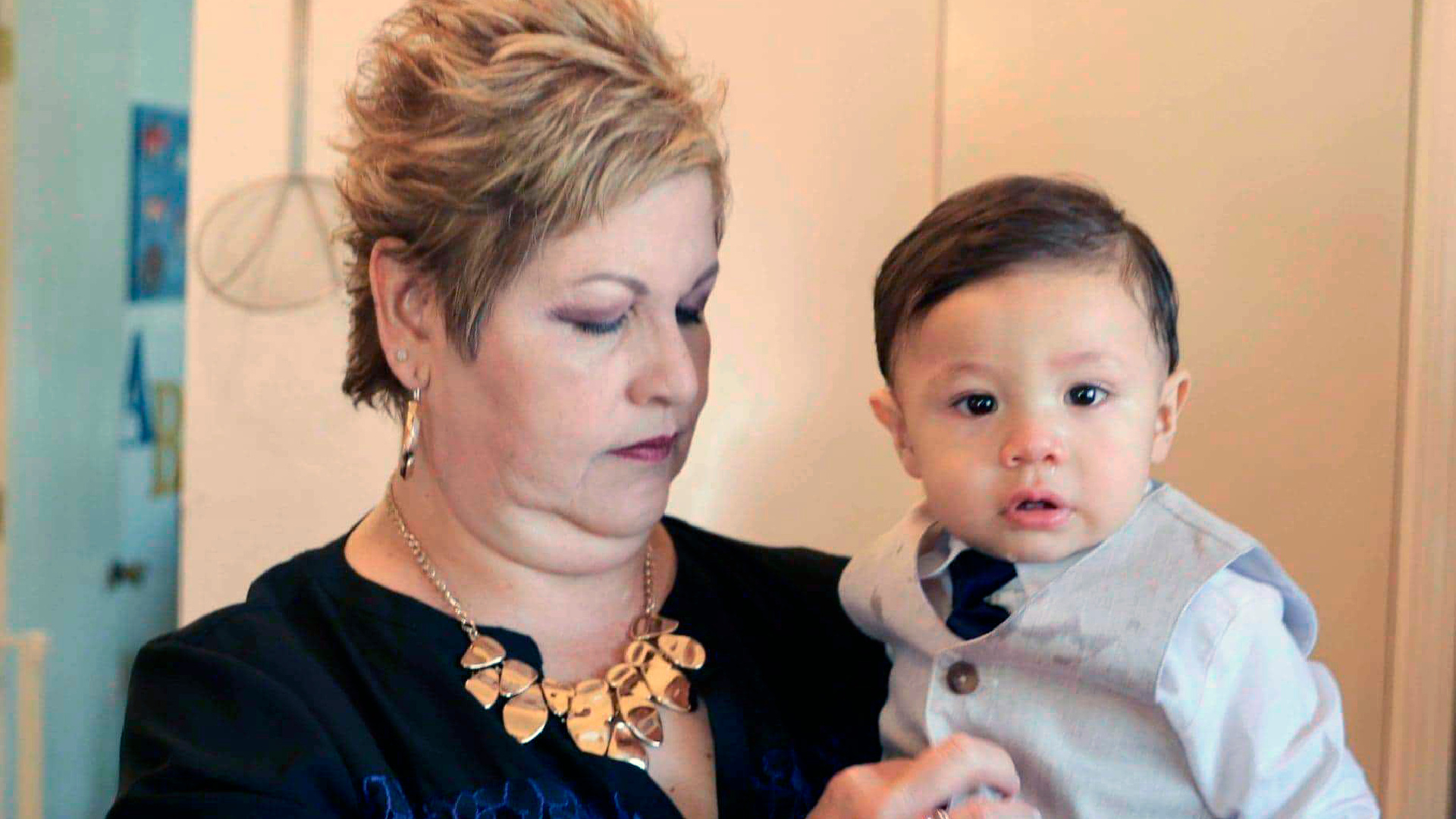 Paul Anchondo is held by his grandmother, Brenda Anchondo in El Paso, Texas on May 23, 2020. The toddler is unlikely to learn until years from now what happened to his parents in events that many El Paso residents still struggle to comprehend, said uncle Tito Anchondo, whose brother Andre and sister-in-law Jordan died in the shooting at a Walmart store last year. (Herman Delgado via The AP)