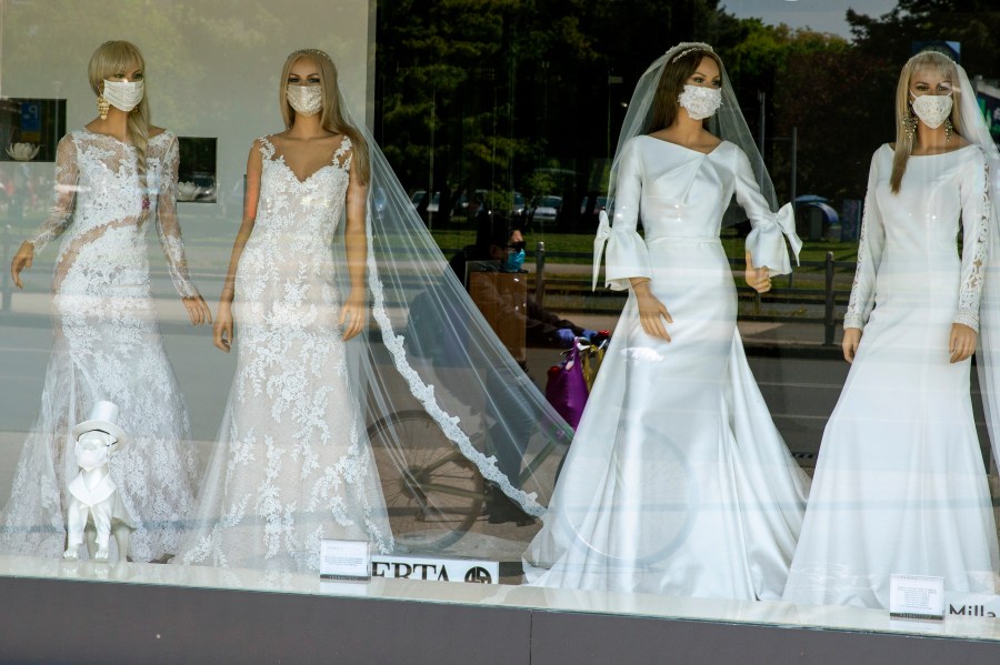 A wedding dress store with mannequins wearing face masks is seen in Zagreb, Croatia on April 23, 2020. (AP Photo/Darko Bandic, File)