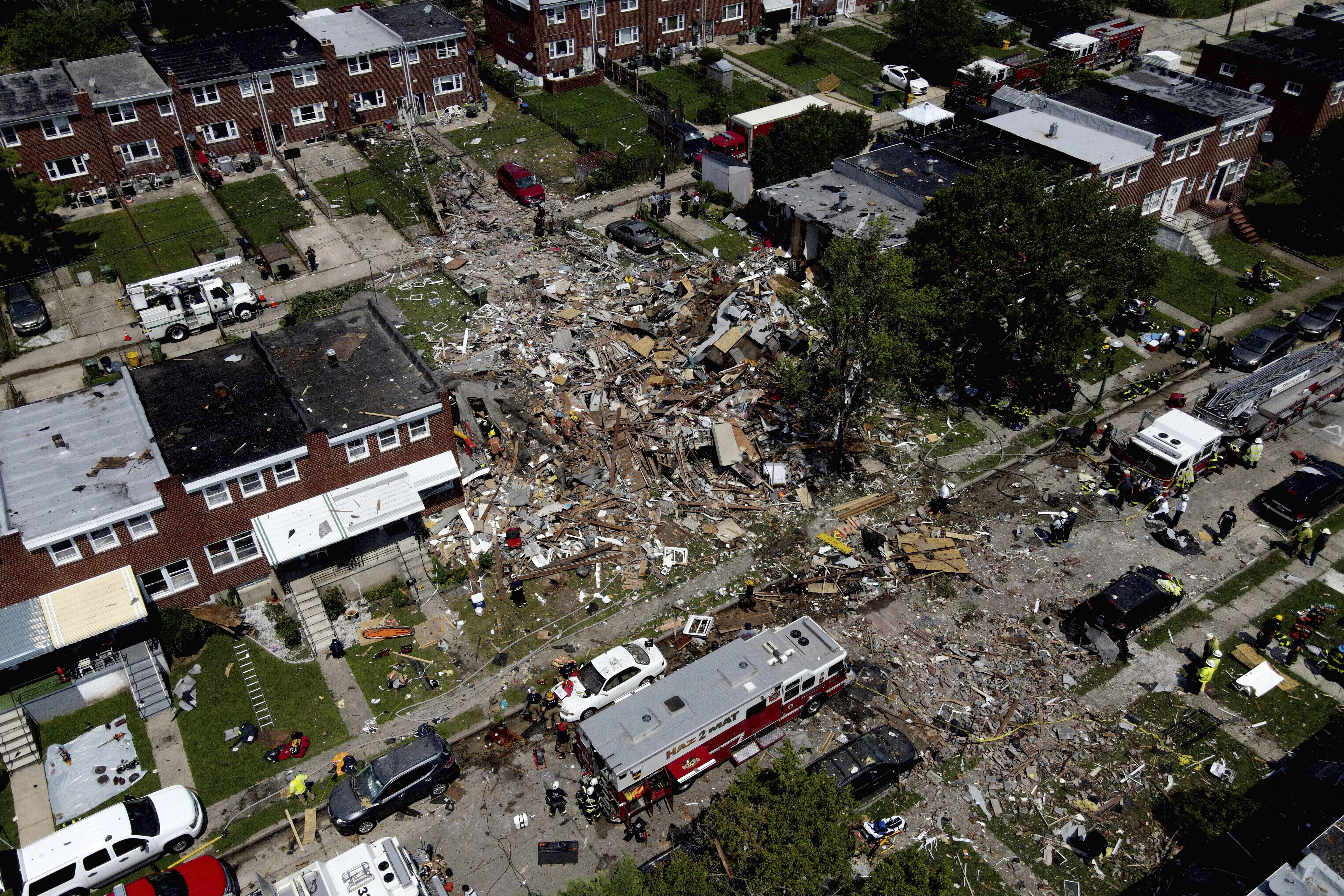 Debris and rubble covers the ground in the aftermath of an explosion in Baltimore on Monday, Aug. 10, 2020. Baltimore firefighters say an explosion has leveled several homes in the city. (AP Photo/Julio Cortez)