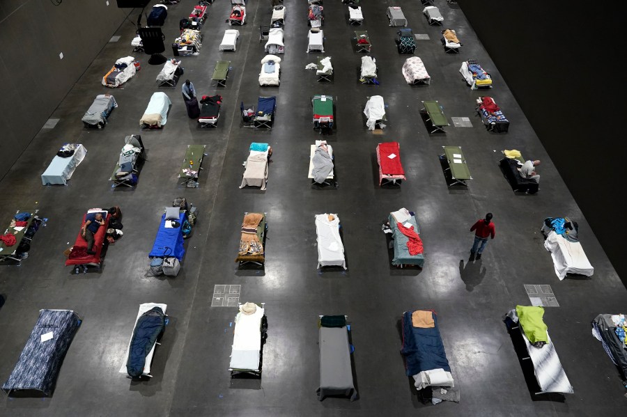 Beds fill a homeless shelter inside the San Diego Convention Center on Aug. 11, 2020, in San Diego. (AP Photo/Gregory Bull)