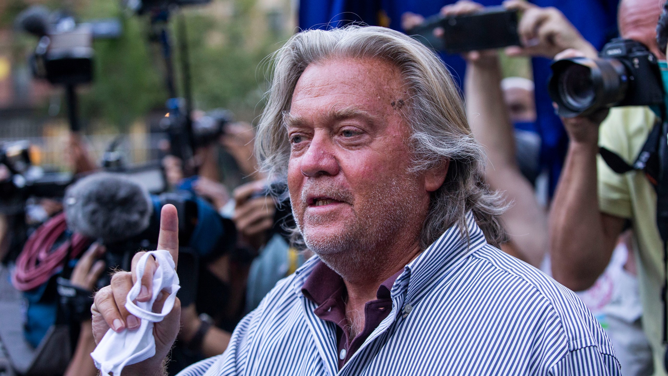 President Donald Trump's former chief strategist Steve Bannon speaks with reporters after pleading not guilty to charges that he ripped off donors to an online fundraising scheme to build a southern border wall Aug. 20, 2020, in New York. (Eduardo Munoz Alvarez/Associated Press)