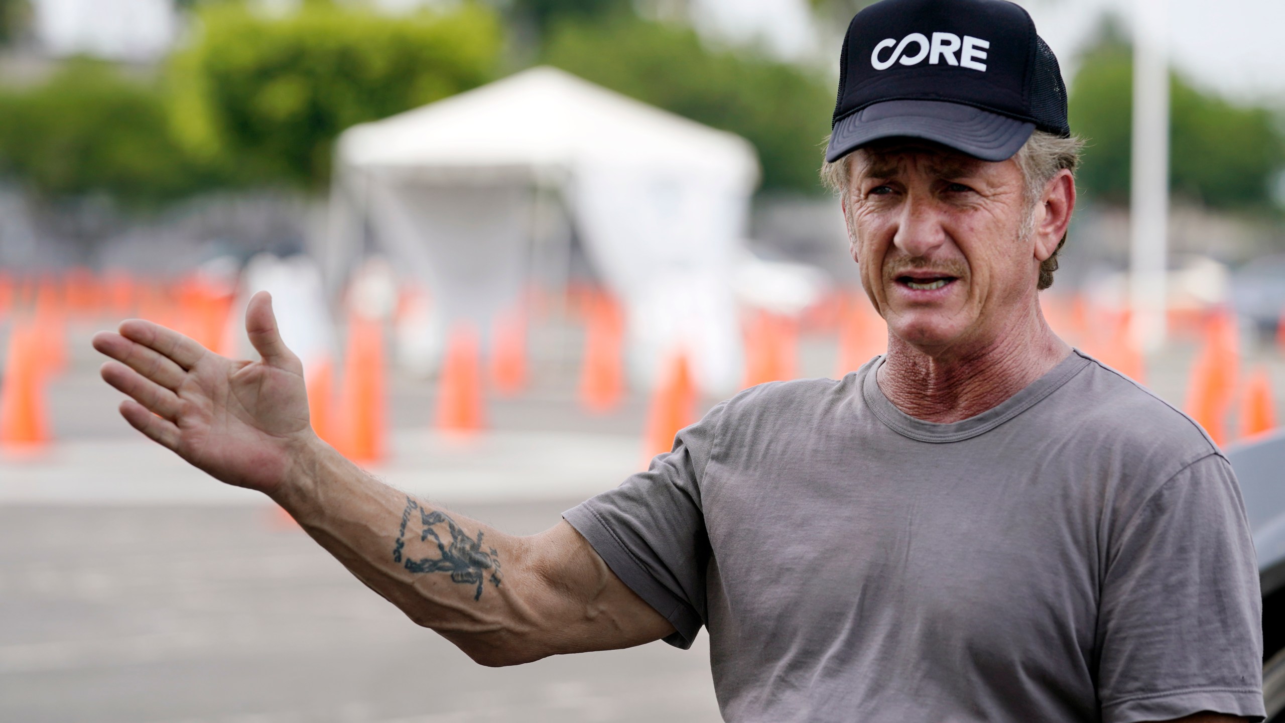 Actor Sean Penn is interviewed at a CORE coronavirus testing site at Crenshaw Christian Center on Aug. 21, 2020, in Los Angeles. (AP Photo/Chris Pizzello)