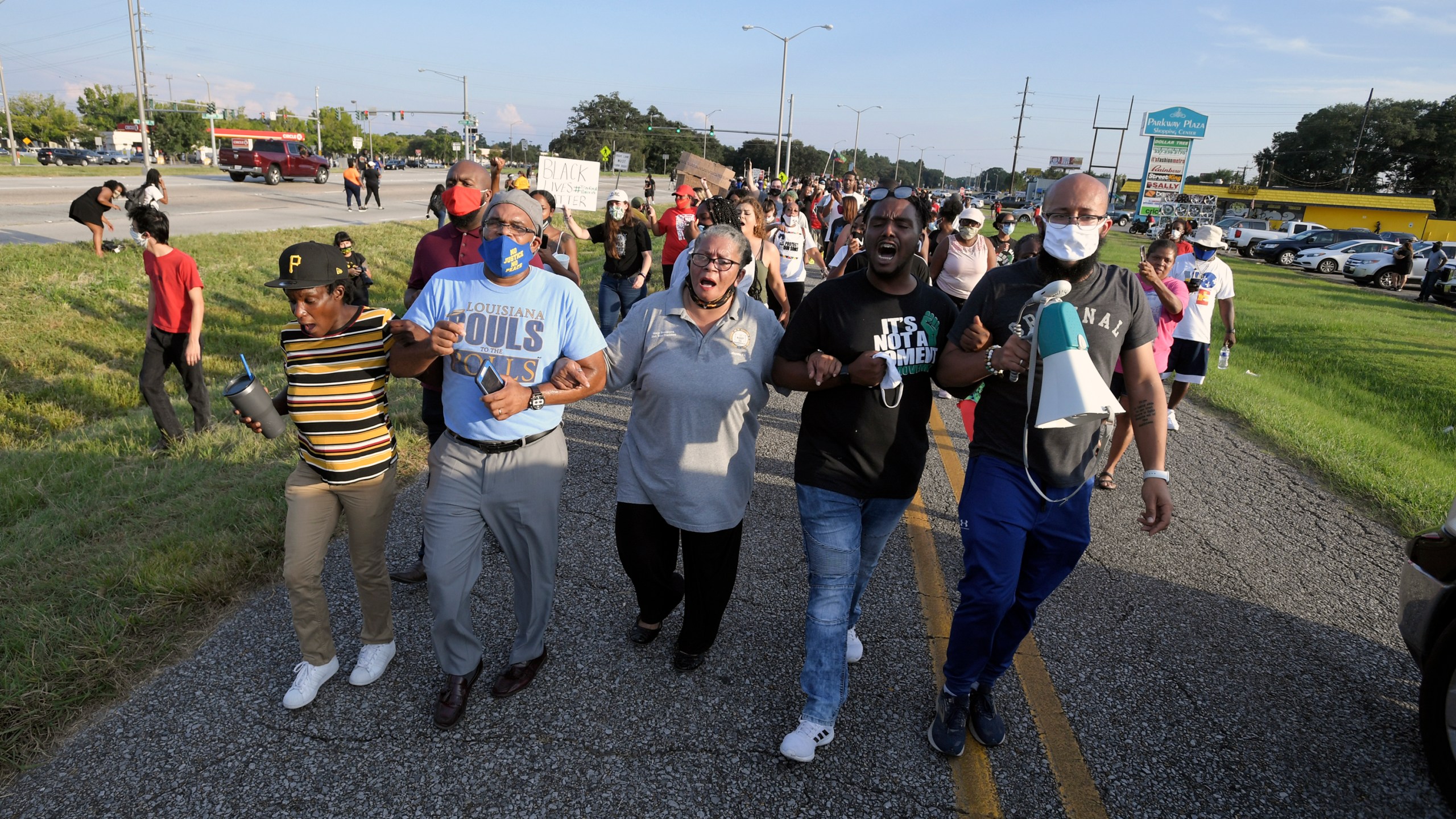 Marja Broussard, center, president of the Lafayette chapter of the NAACP, walks down Evangline Thruway with others demanding justice for Trayford Pellerin on Aug. 22, 2020, in Lafayette. (Brad Kemp/The Advocate via AP)