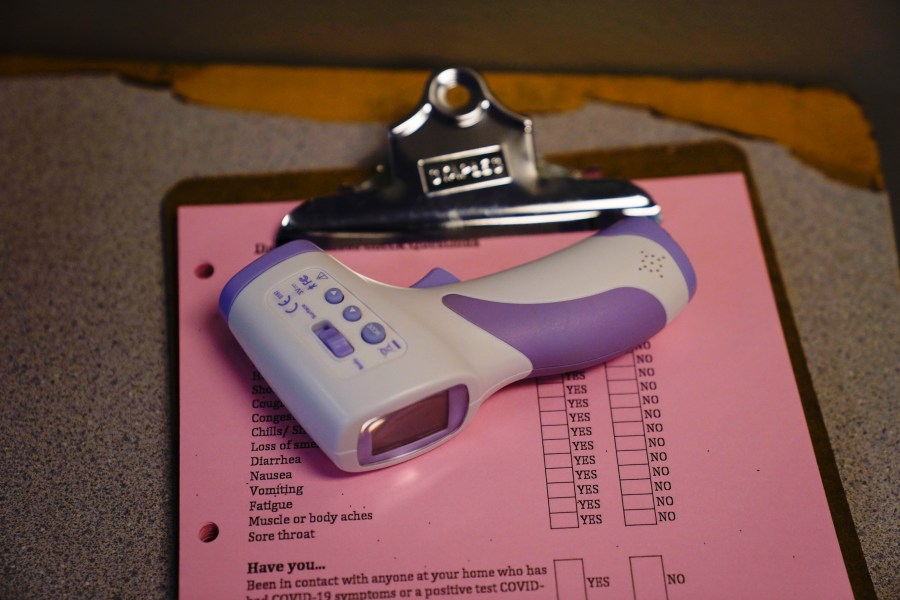 An infrared thermometer is seen near the entrance at the Boys & Girls Club of Hollywood on Aug. 26, 2020. (Jae C. Hong / Associated Press)