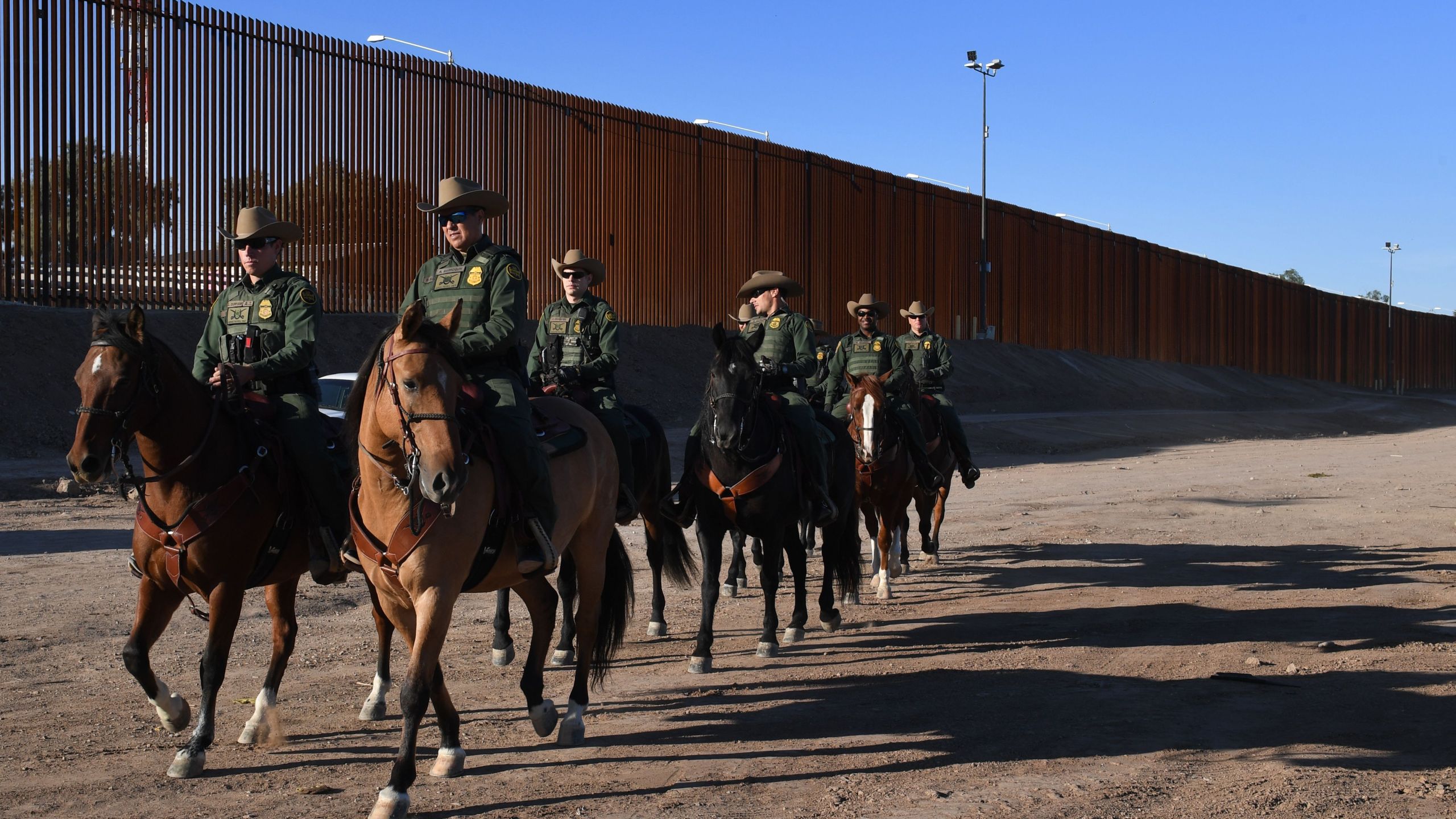 Mounted Border Patrol officers are seen on patrol in the El Centro Sector, at the U.S.- Mexico border in Calexico, California on Oct. 26, 2018. (MARK RALSTON/AFP via Getty Images)