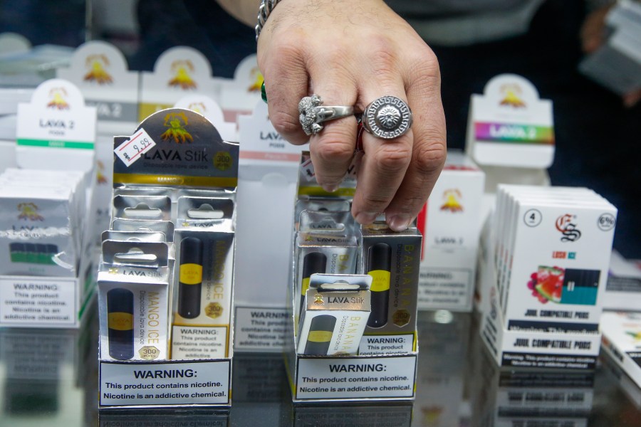 A worker organizes E-cigarette disposable units in a Jersey City, New Jersey, store on Jan. 2, 2020. (Eduardo Munoz Alvarez / Getty Images)