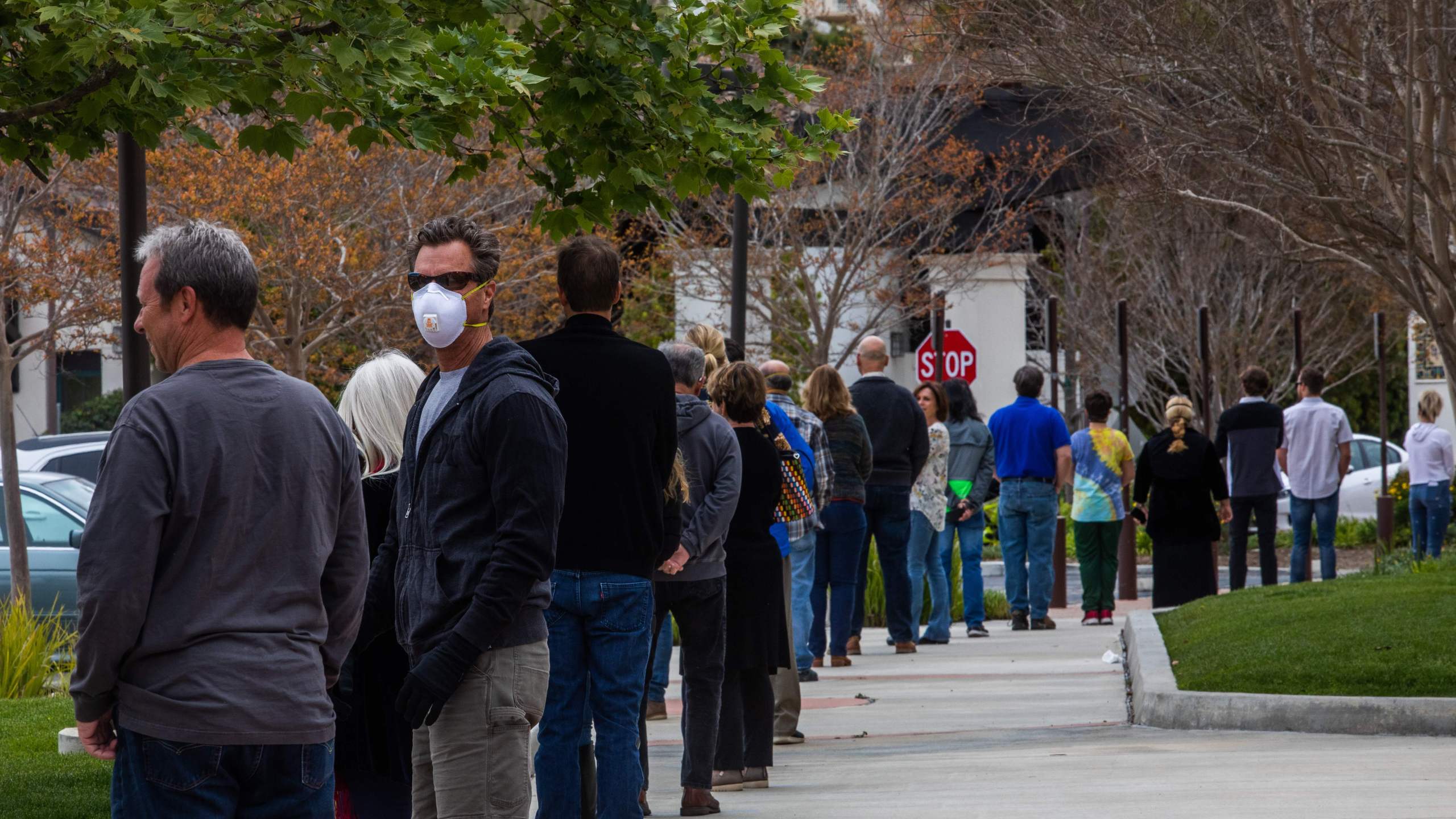 People wait in line to get into the Godspeak Calvary Chapel in Thousand Oaks to take communion after watching Palm Sunday Service on April 5, 2020. (Apu Gomes / AFP / Getty Images)