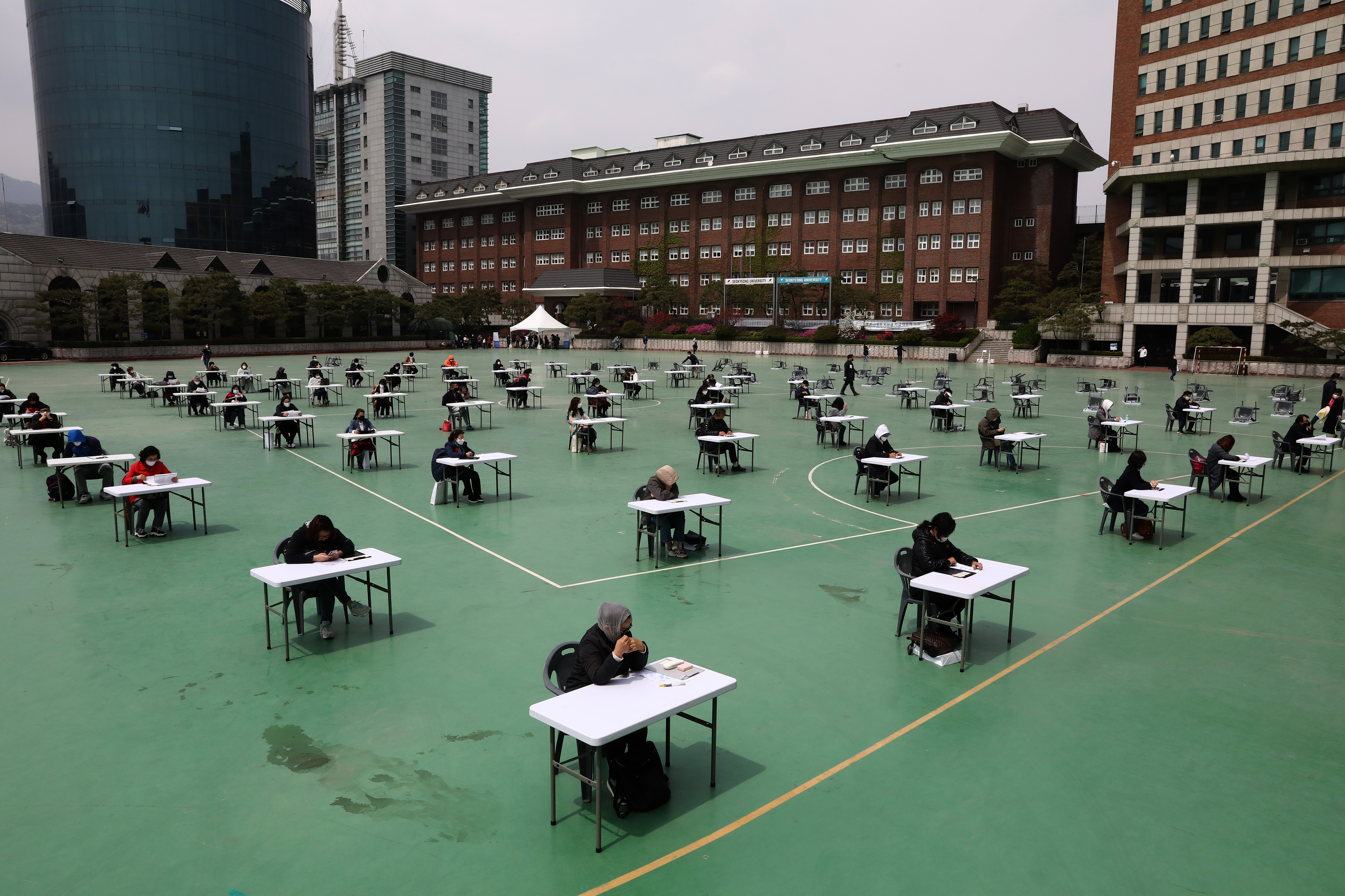 Students take an exam outdoors at Seokyeong University on April 25, 2020 in Seoul, South Korea. (Chung Sung-Jun/Getty Images)