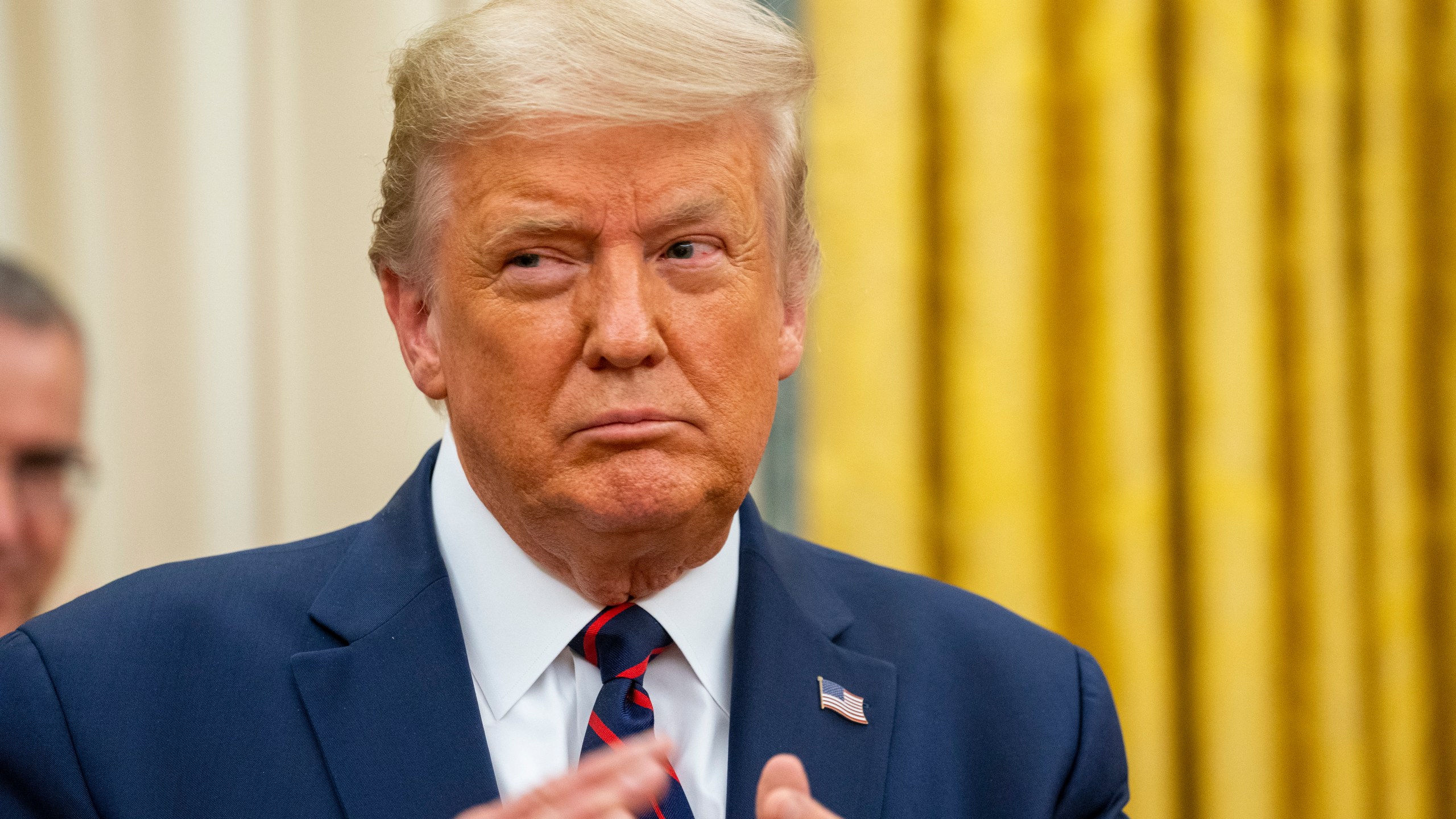 Donald Trump participates in the swearing in of General Charles Q. Brown as the incoming Chief of Staff of the Air Force, in the Oval Office of the White House on Aug. 4, 2020. (Doug Mills-Pool/Getty Images)