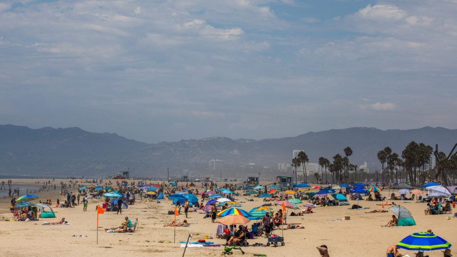 People lounge at the beach amid the severe heat wave in Venice on Aug. 15, 2020.(Apu Gomes/AFP via Getty Images)