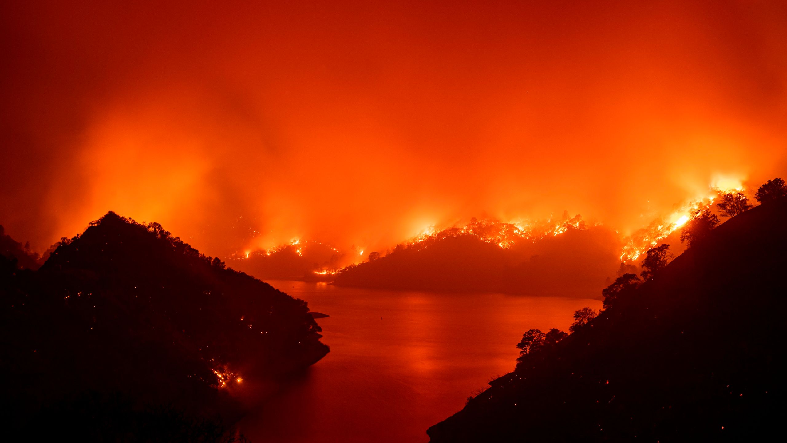 Flames surround Lake Berryessa during the LNU Lightning Complex fire in Napa, California on Aug. 19, 2020. (JOSH EDELSON/AFP via Getty Images)