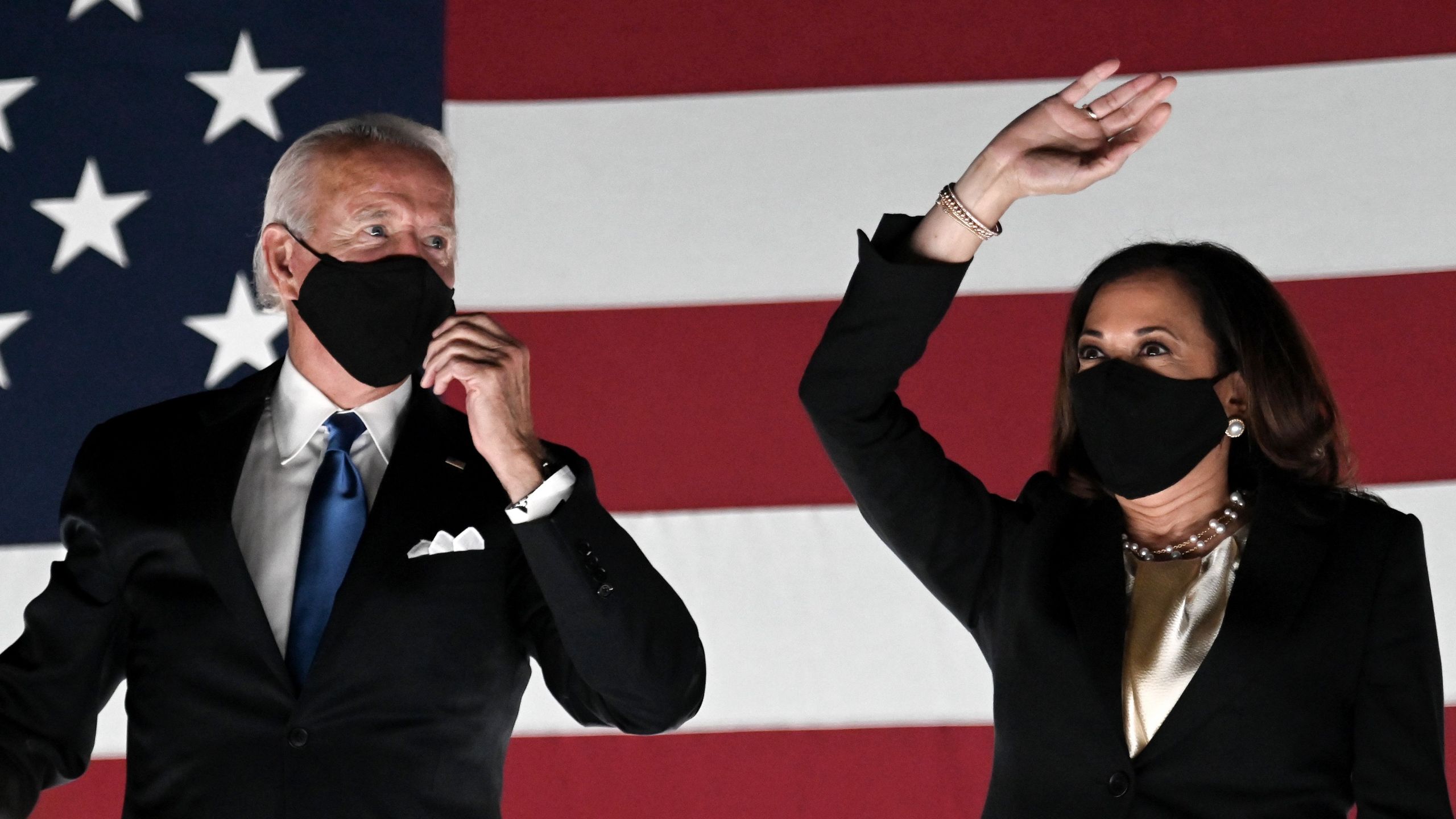 Former vice-president and Democratic presidential nominee Joe Biden and Democratic vice presidential nominee Sen. Kamala Harris greet supporters outside the Chase Center in Wilmington, Delaware, at the conclusion of the Democratic National Convention on Aug. 20, 2020. (Olivier DOULIERY/AFP via Getty Images)