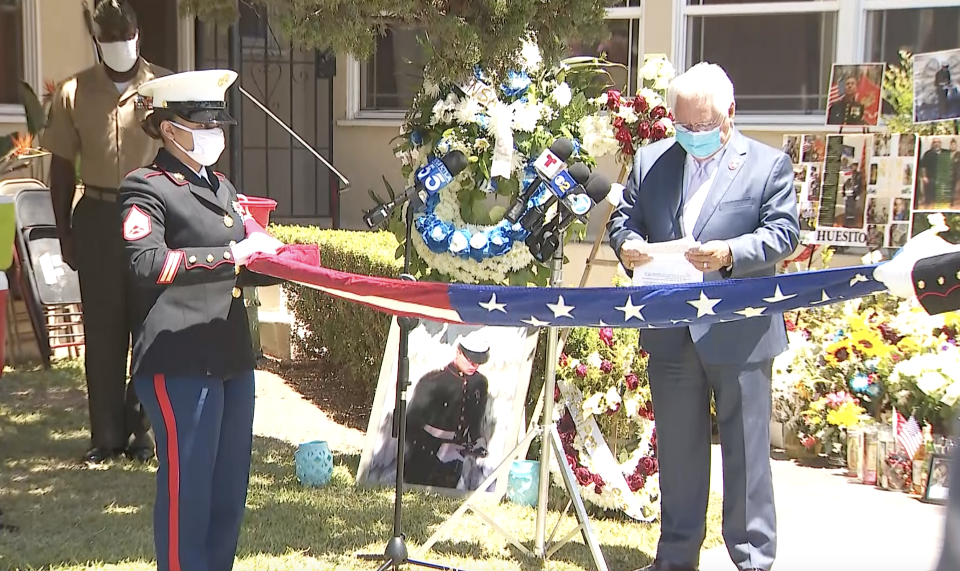 California State Sen. Bob Archuleta on Sunday presented a flag to the family of Lance Cpl. Marco Barranco at their Montebello home on Aug. 9, 2020. (KTLA)