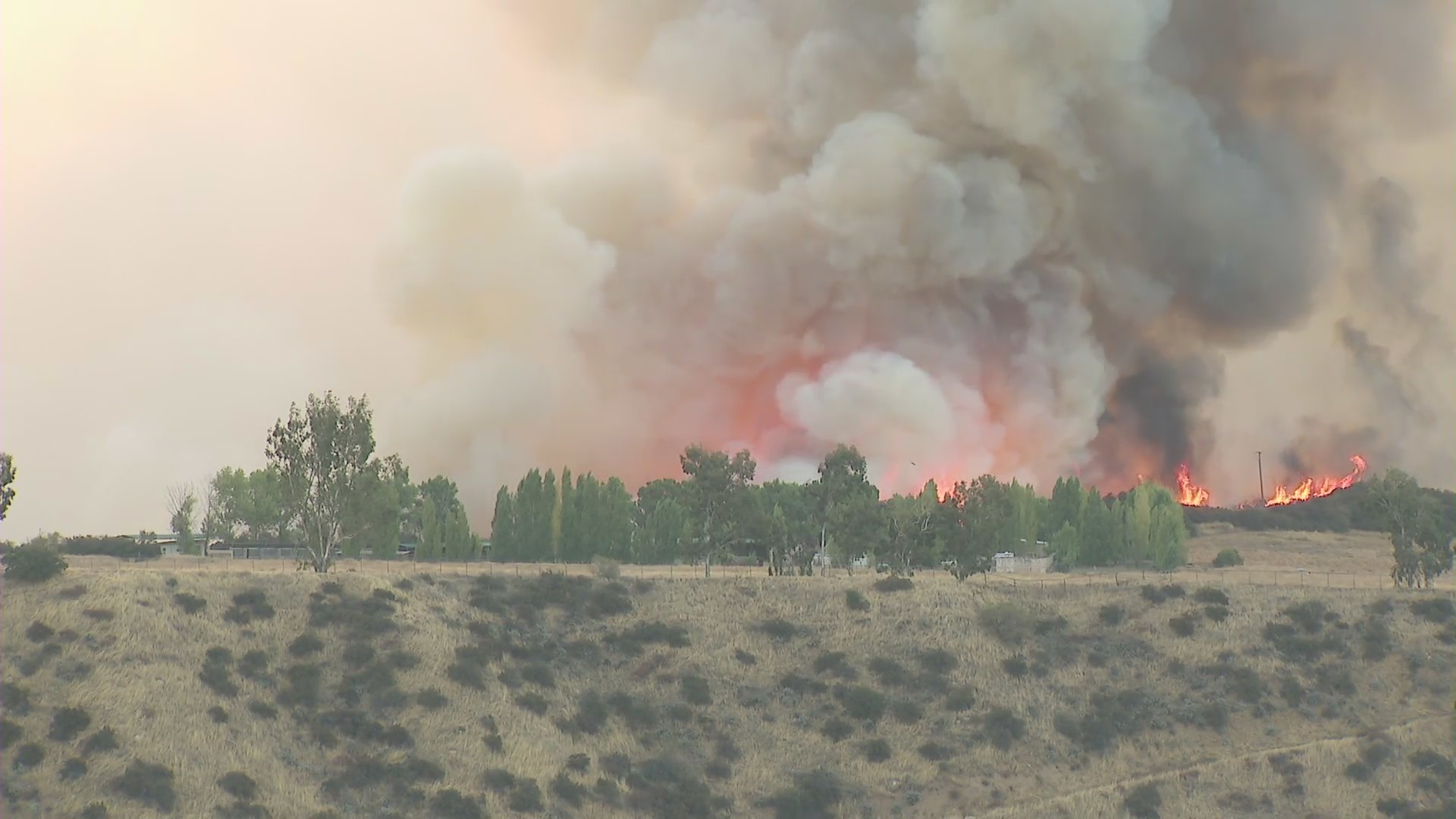 The Apple Fire burns in the Cherry Valley area of Riverside County on Aug. 1, 2020. (KTLA)