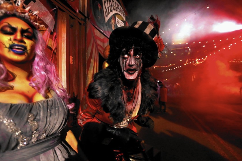 Oceana, left, and the Ring Master greet visitors to Dark Harbor, the annual Halloween festivity on the Queen Mary in Long Beach, in 2015. This year's event has been canceled. (Genaro Molina / Los Angeles Times)