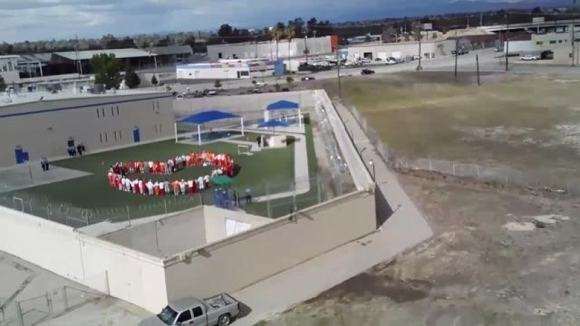 Hunger strikers at Mesa Verde ICE Processing Center in Bakersfield were captured by drone during a sit-in protest on April 10, 2020. (California Committee for Immigrant Liberation)