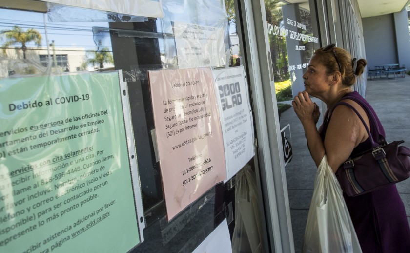 Brenda Bermudez came looking for information about her unemployment claim in May 2020 but found the California Employment Development Department office in Canoga Park closed. (Brian van der Brug / Los Angeles Times)