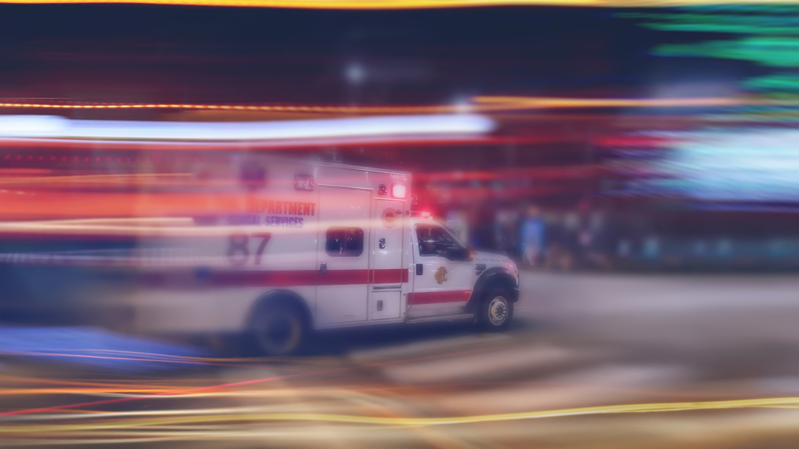 An ambulance speeds through traffic in a file image. (Credit: iStock / Getty Images Plus)