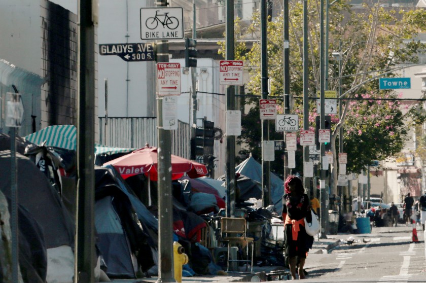 Homeless encampments line the sidewalk along Fifth Street in downtown Los Angeles on Aug. 11, 2020. (Luis Sinco/Los Angeles Times)