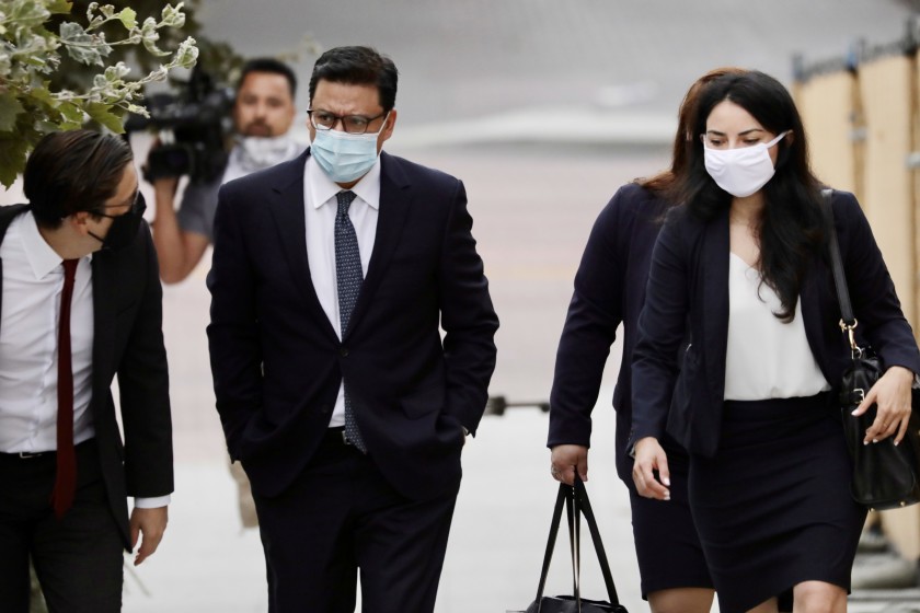 Los Angeles City Councilman Jose Huizar, center, arrives Wednesday at the federal courthouse in downtown Los Angeles. (Irfan Khan / Los Angeles Times)