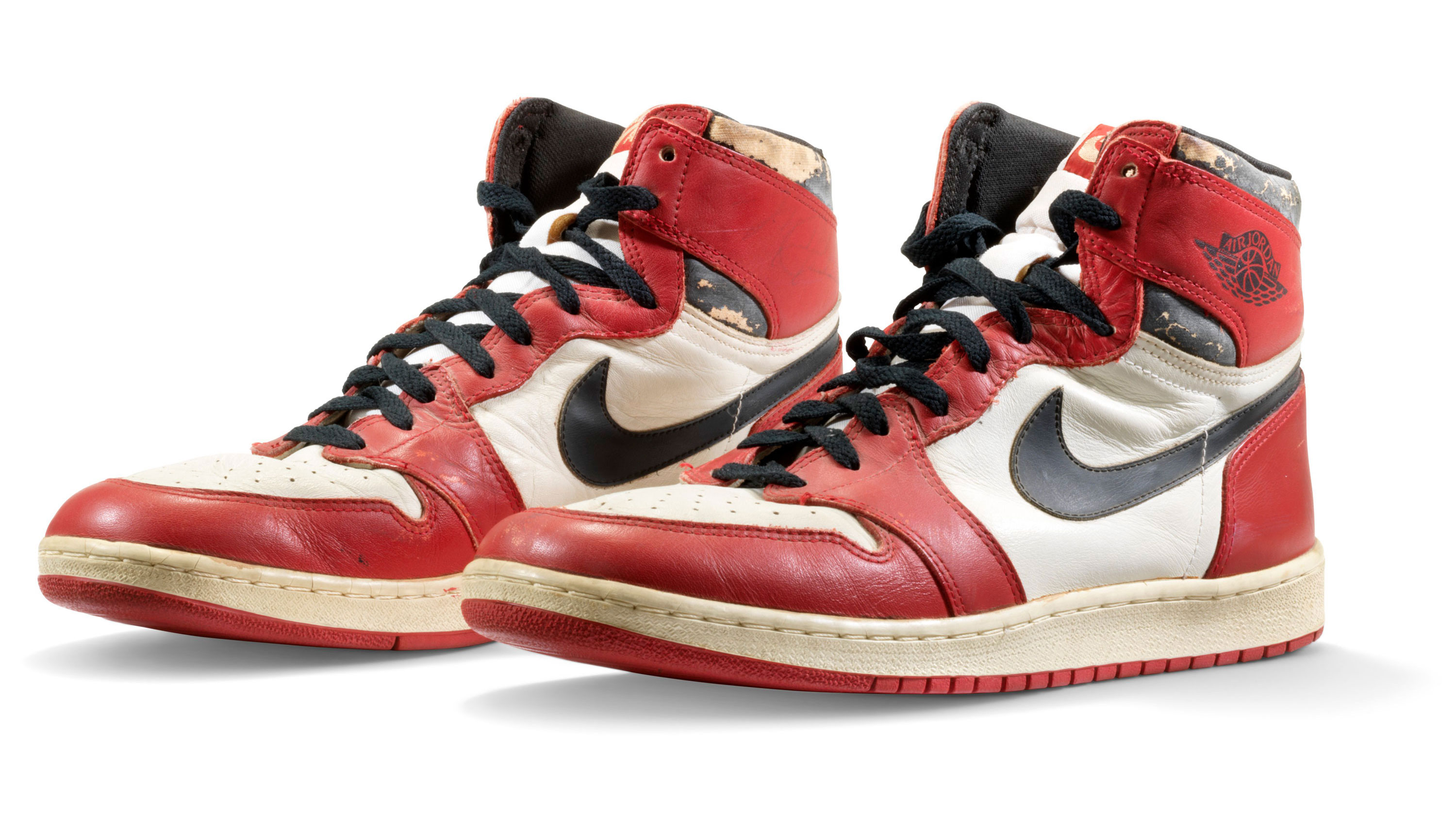 A pair of Michael Jordan's sneakers from 1985 have sold at auction for $615,000. (CNN)