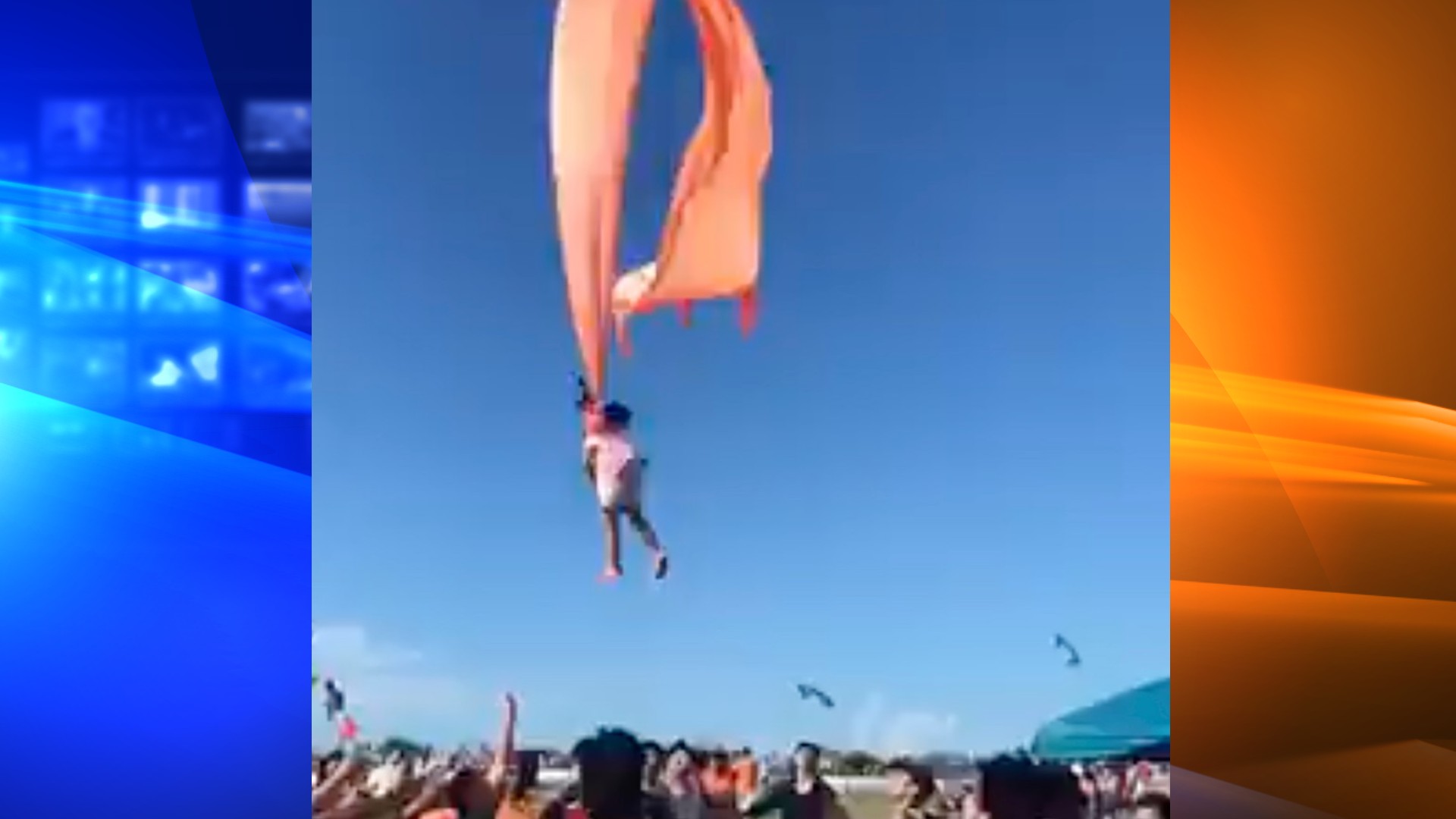 In this image made from video, a 3 year old girl is lifted into the air by a large kite during a kite festival in Hsinchu, northern Taiwan, Sunday, Aug. 30, 2020. (Credit: Dainese Hsu)