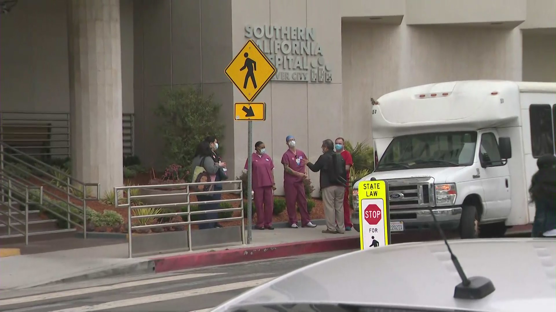 Nurses begin to gather for a rally to demand better COVID-19 safety. (KTLA)