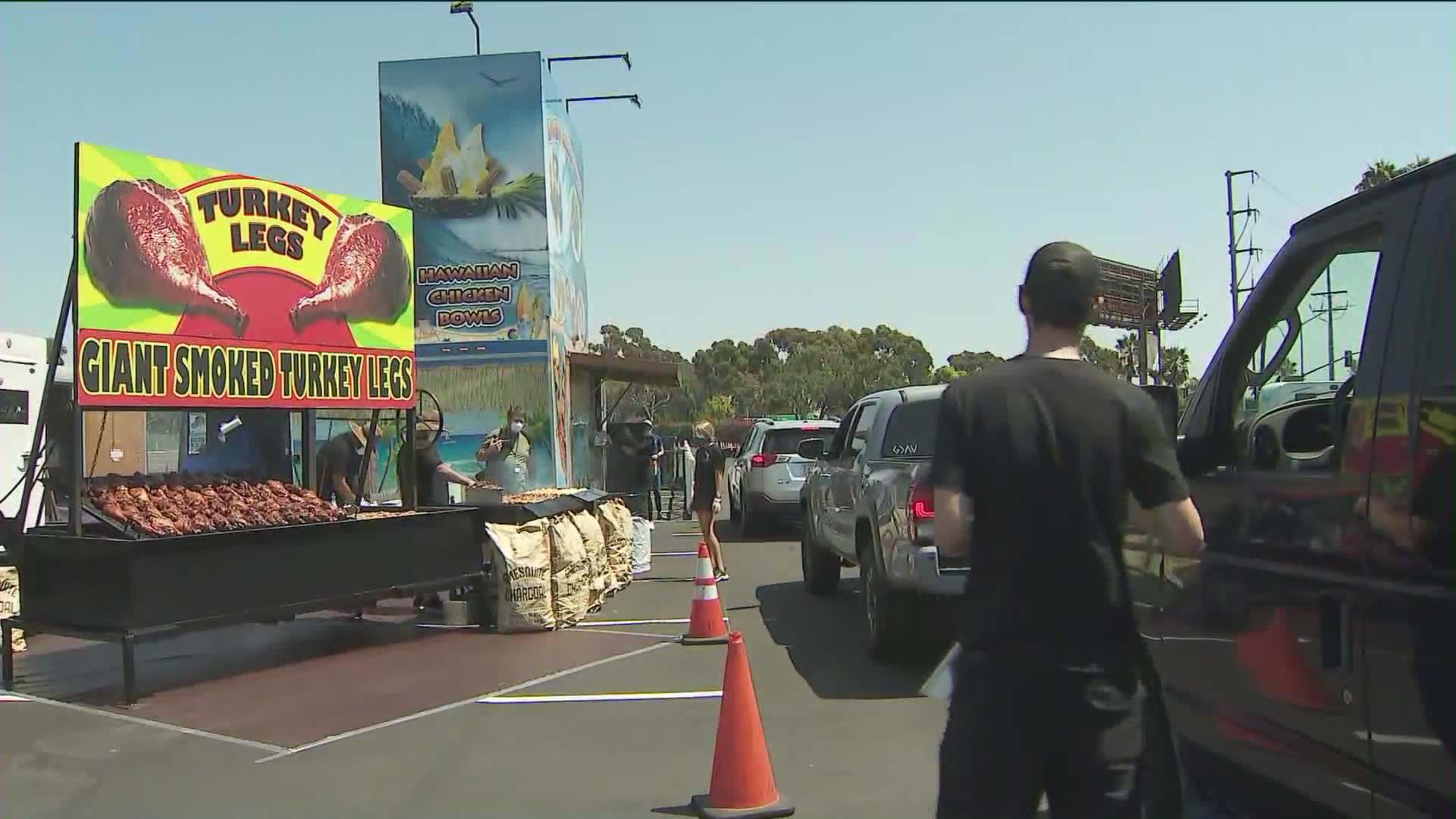 Turkey legs are offered at the O.C. Fair food drive-thru in Costa Mesa in August 2020. (KTLA)